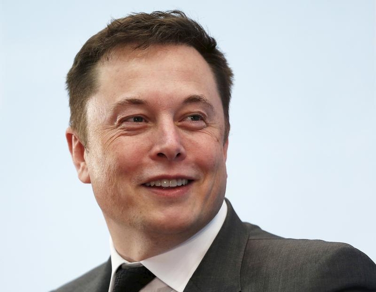 Tesla Chief Executive Elon Musk smiles as he attends a forum on startups in Hong Kong