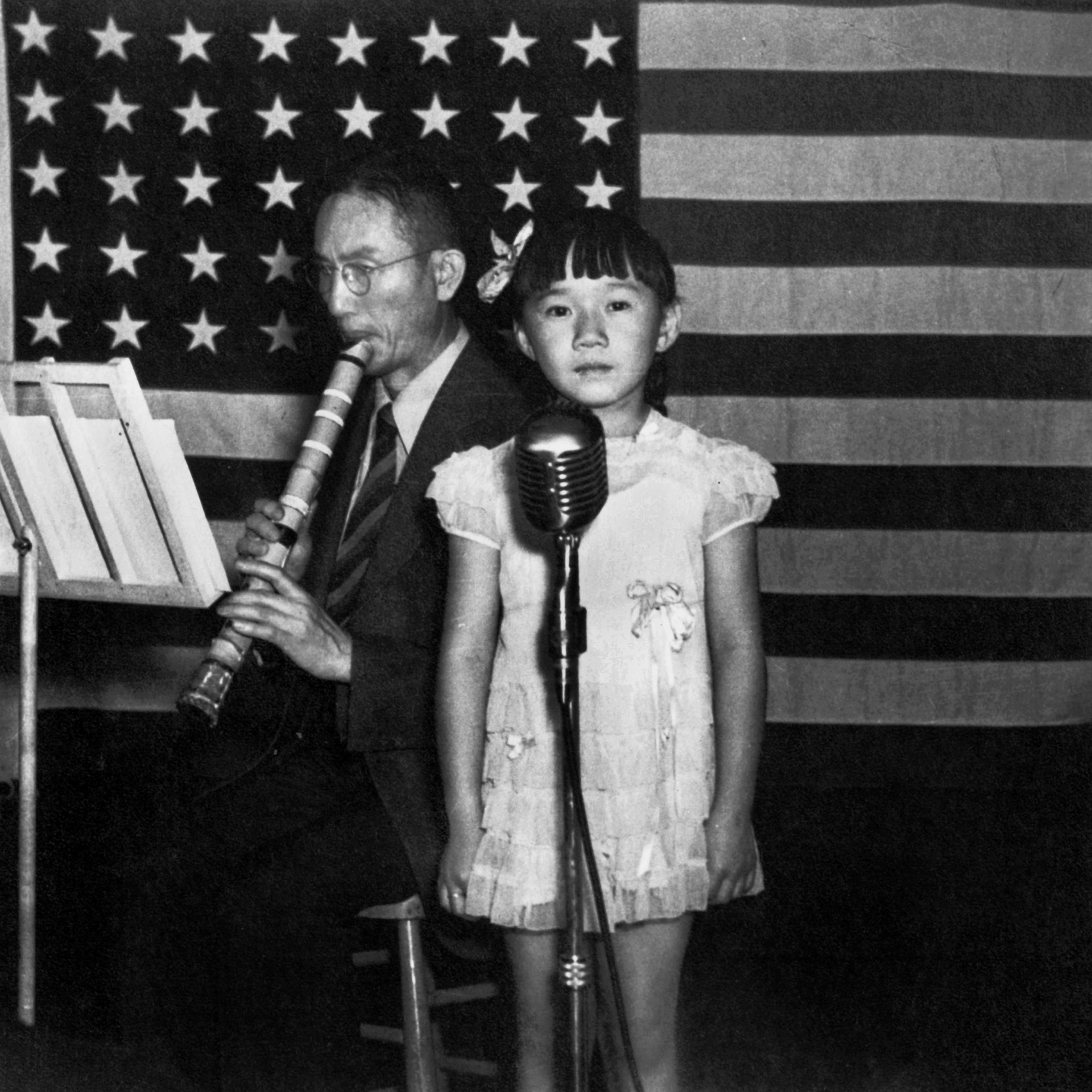 A musician and a girl in Topaz Internment Camp in Utah, July 1945