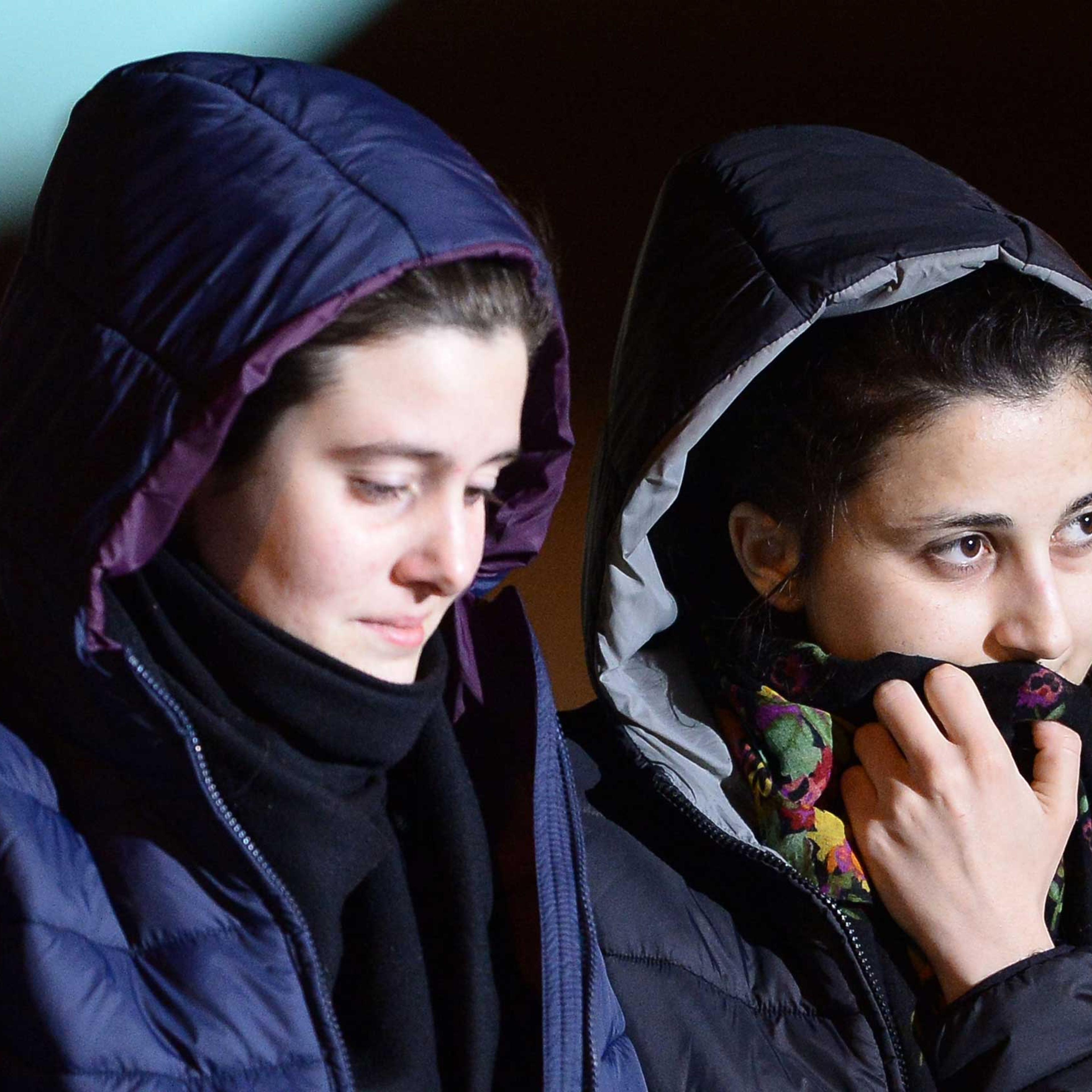 Italian aid workers abducted in Syria last summer, Greta Ramelli (L) and Vanessa Marzullo arrive at Ciampino airport in Rome early on Jan. 16, 2015.