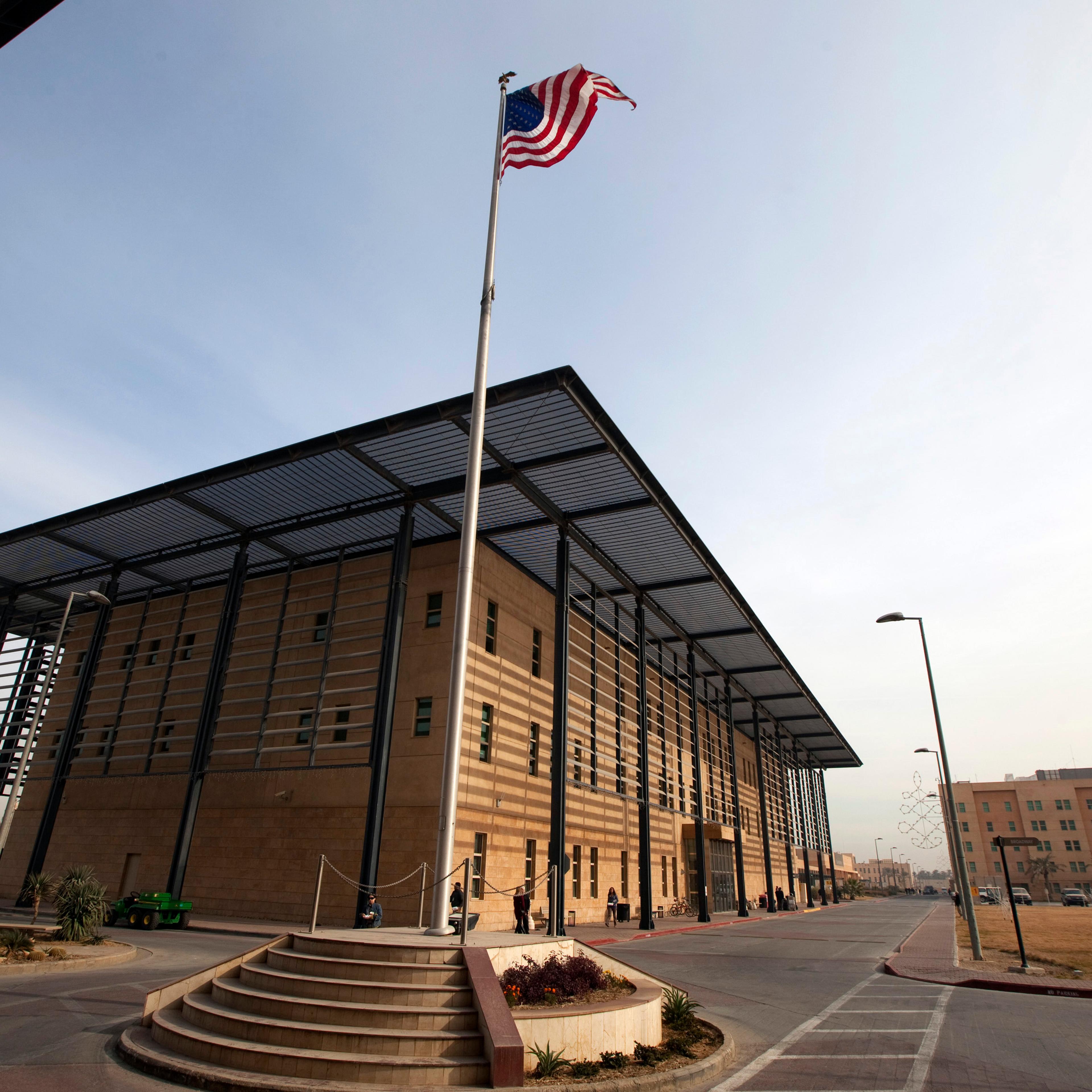 A U.S. flag flies in front of the Annex I building inside the compound of the U.S. embassy in Baghdad