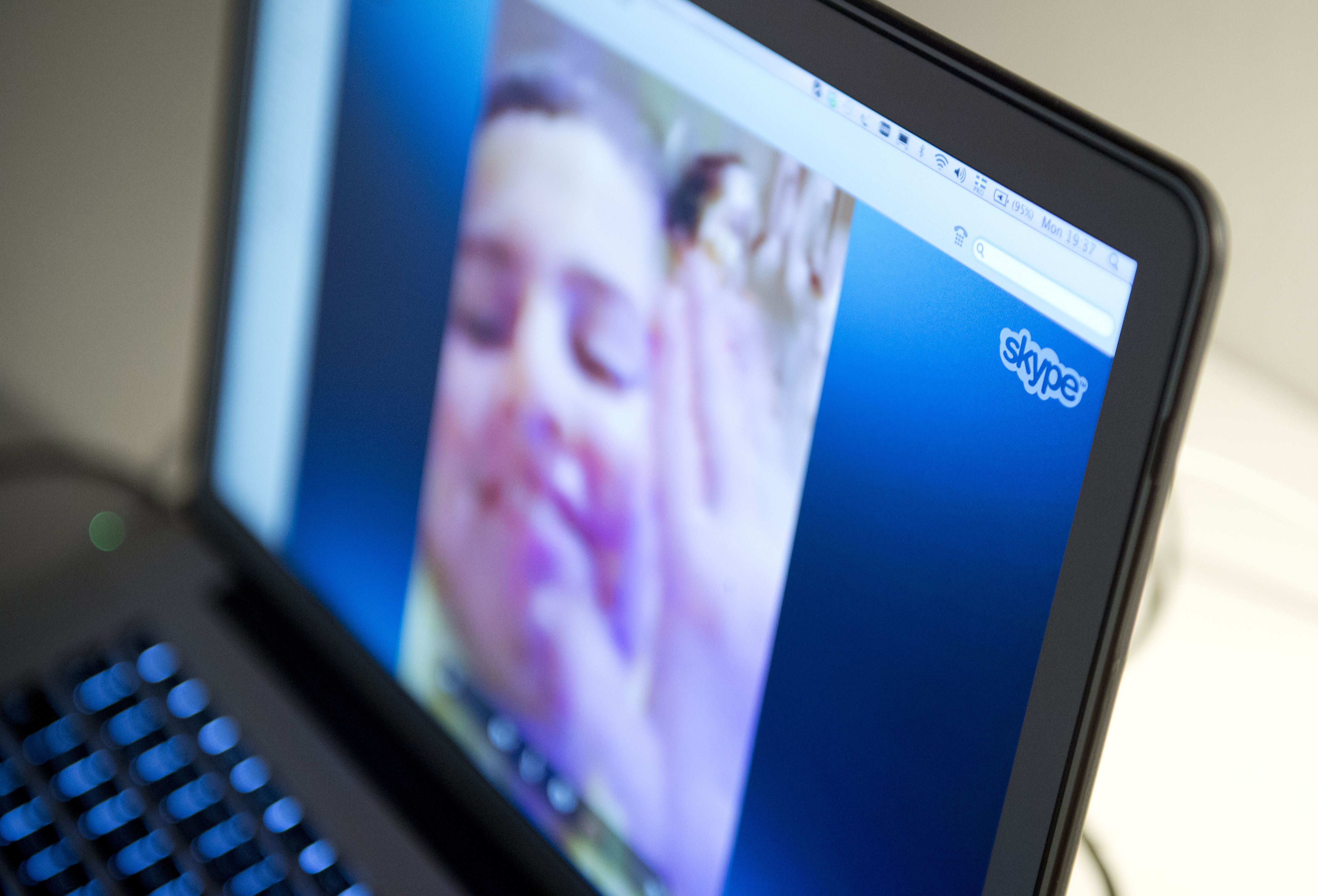 A woman communicates with her family abroad by using the Internet telephone system Skype on August 26, 2013 in Stockholm, Sweden.
