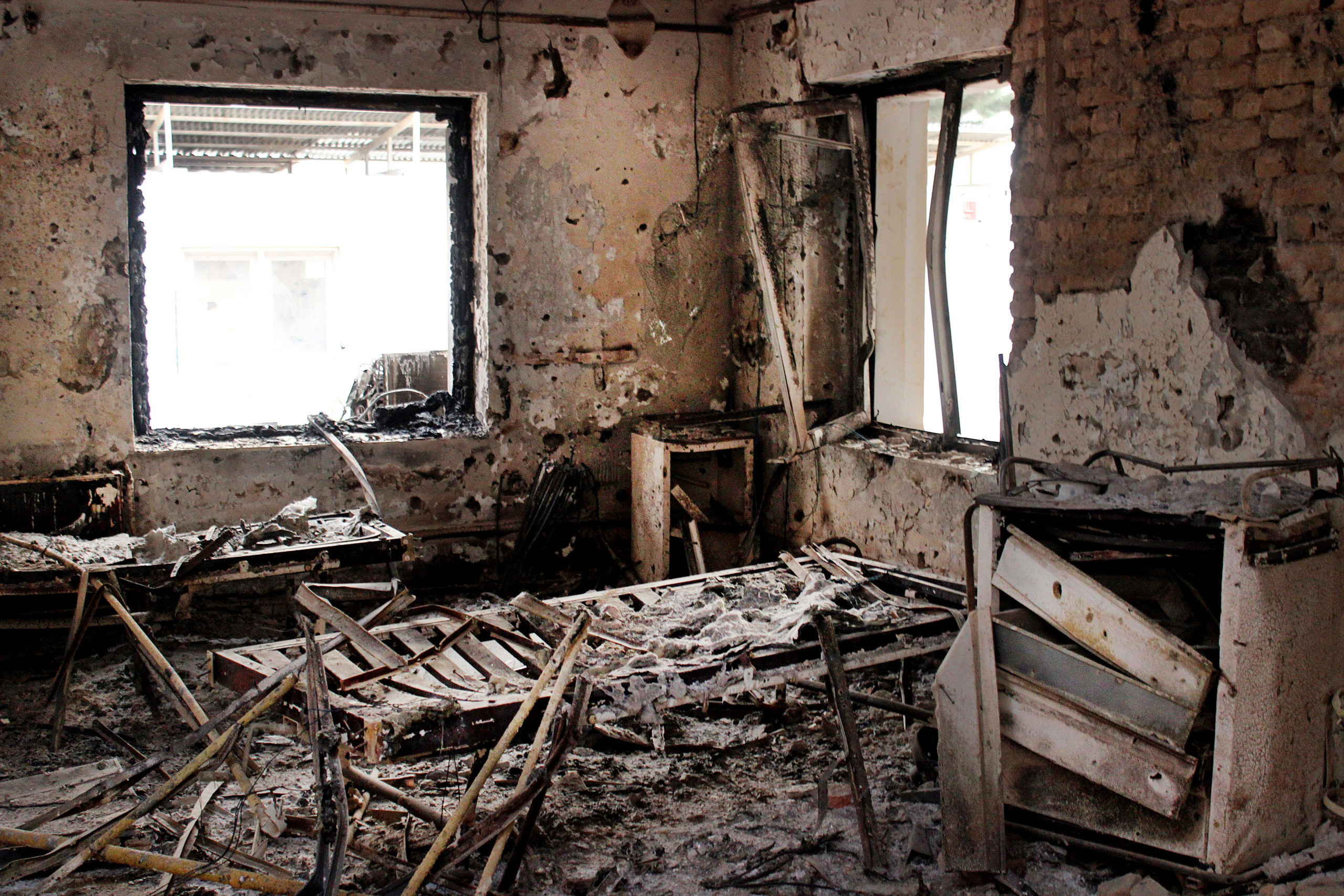 FILE - This Friday, Oct. 16, 2015, file photo shows the charred remains of their hospital after it was hit by a U.S. airstrike in Kunduz, Afghanistan. The U.S. military is paying hundreds of thousands of dollars to wounded survivors and relatives of the 