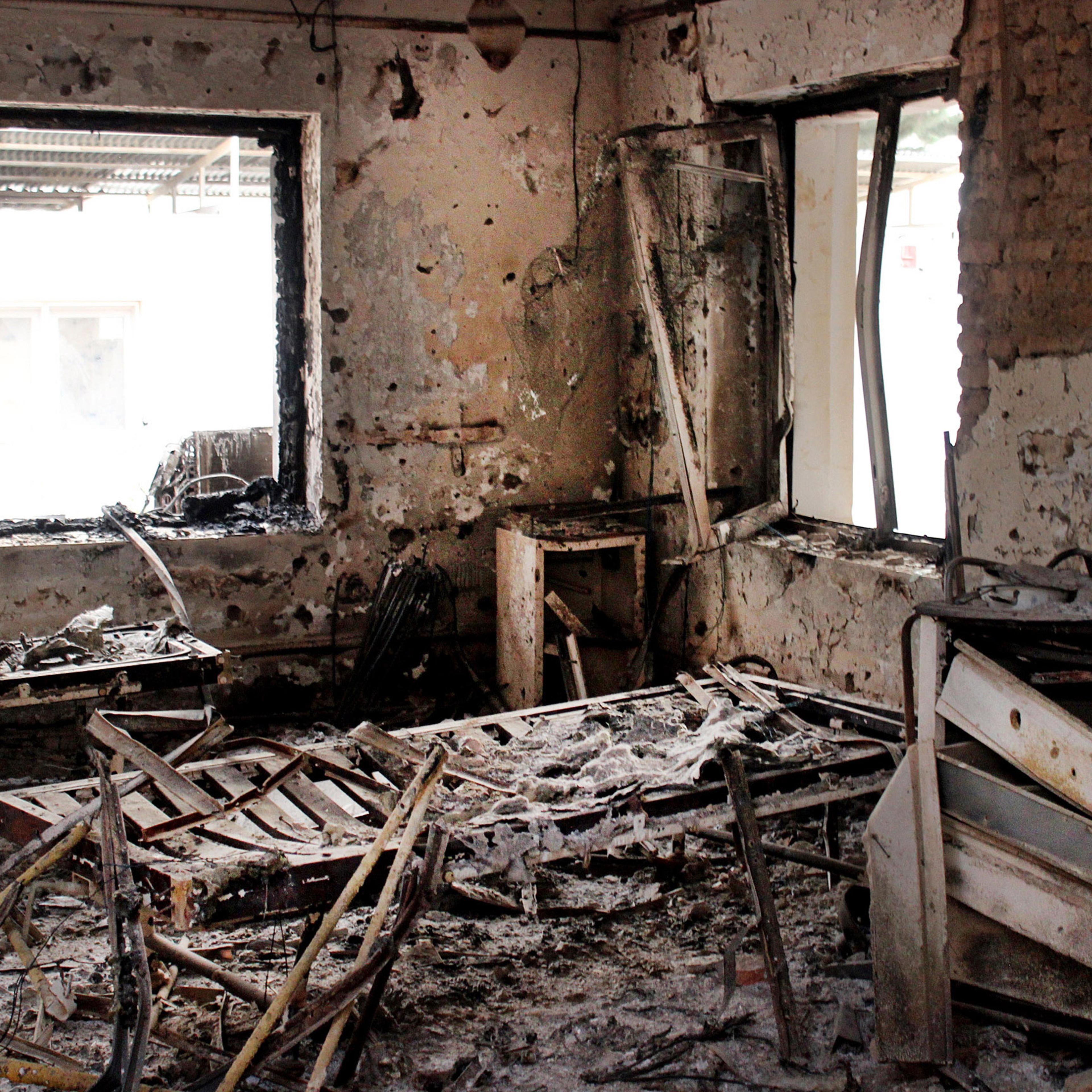 FILE - This Friday, Oct. 16, 2015, file photo shows the charred remains of their hospital after it was hit by a U.S. airstrike in Kunduz, Afghanistan. The U.S. military is paying hundreds of thousands of dollars to wounded survivors and relatives of the