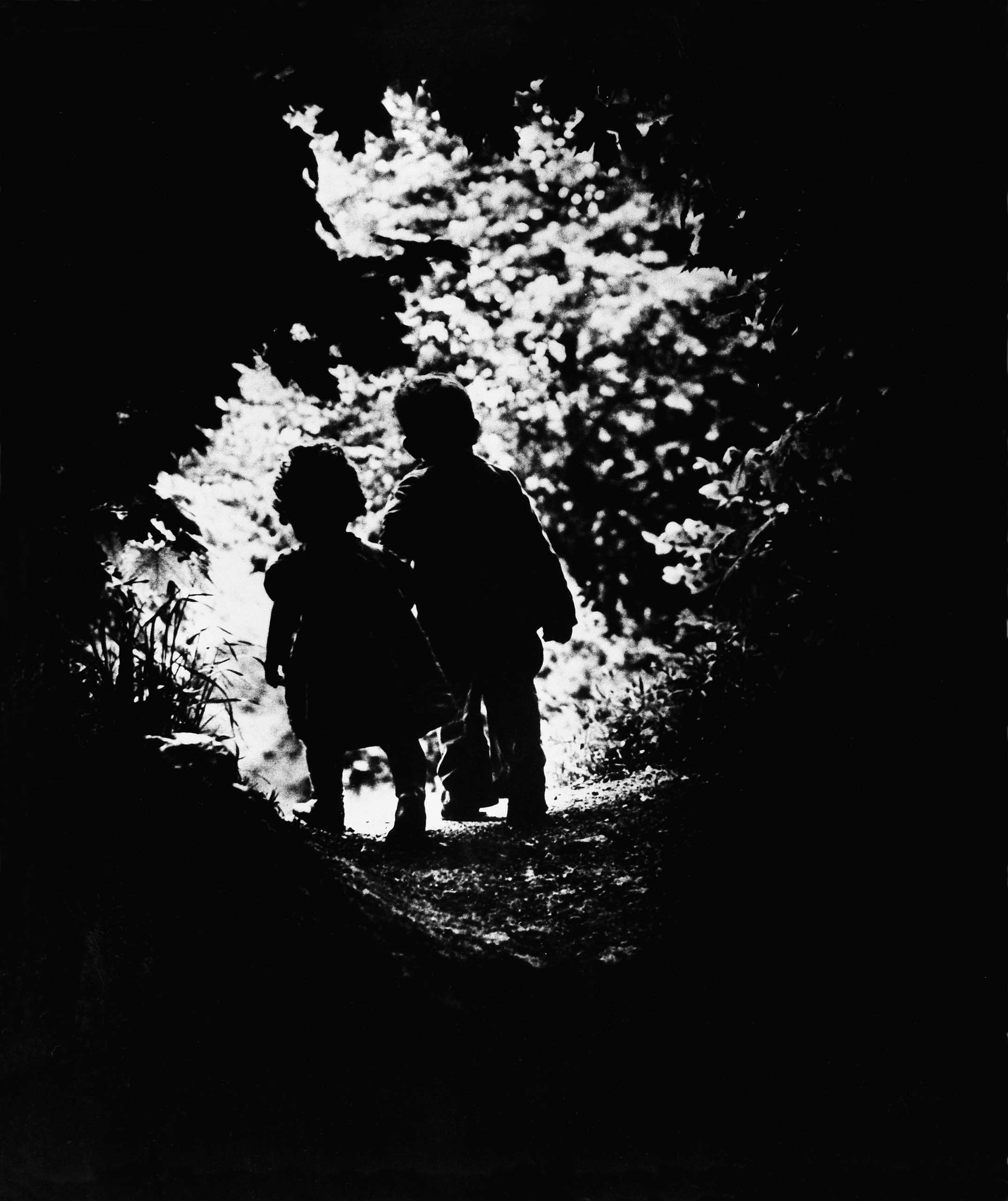 LIFE photographer W. Eugene Smith's children, Juanita and Patrick, walk hand-in-hand into a clearing in 1946. The photo was the closing image in Edward Steichen's now-legendary 1955 MoMA exhibition, The Family of Man, and was one of the very first that S