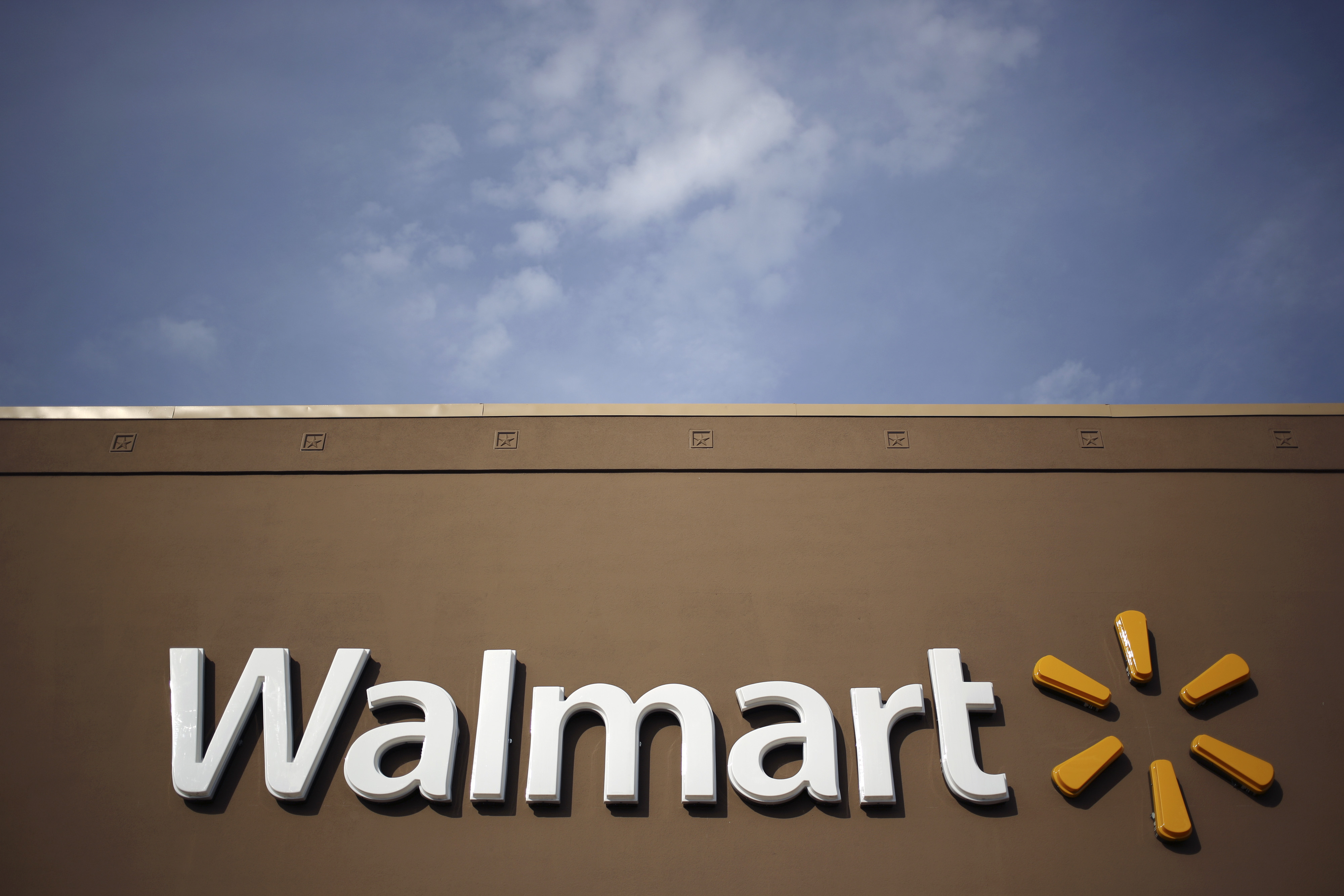 Wal-Mart Stores Inc. signage is displayed outside of a store in Louisville, Kentucky, U.S., on Friday, May 15, 2015.