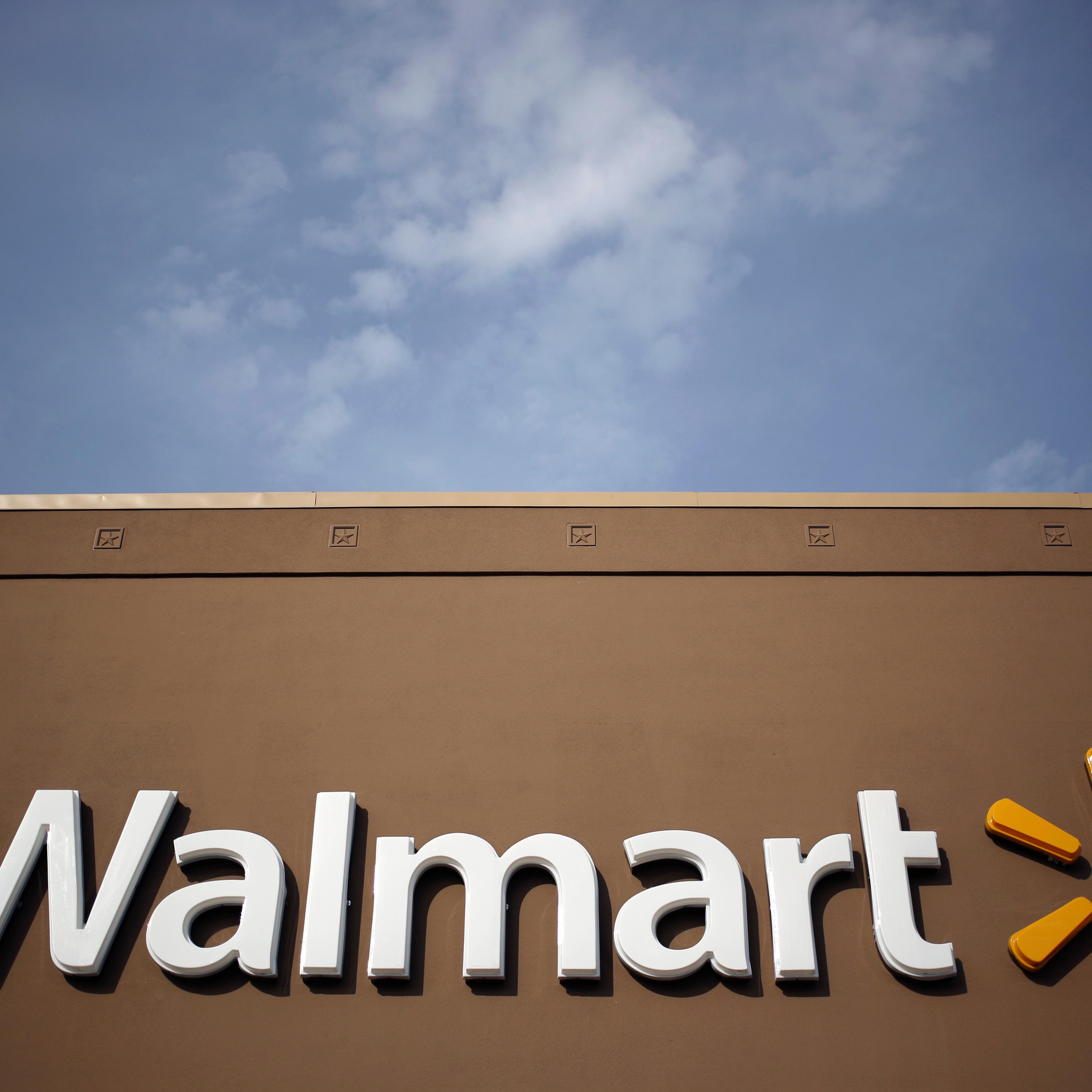 Wal-Mart Stores Inc. signage is displayed outside of a store in Louisville, Kentucky, U.S., on Friday, May 15, 2015.