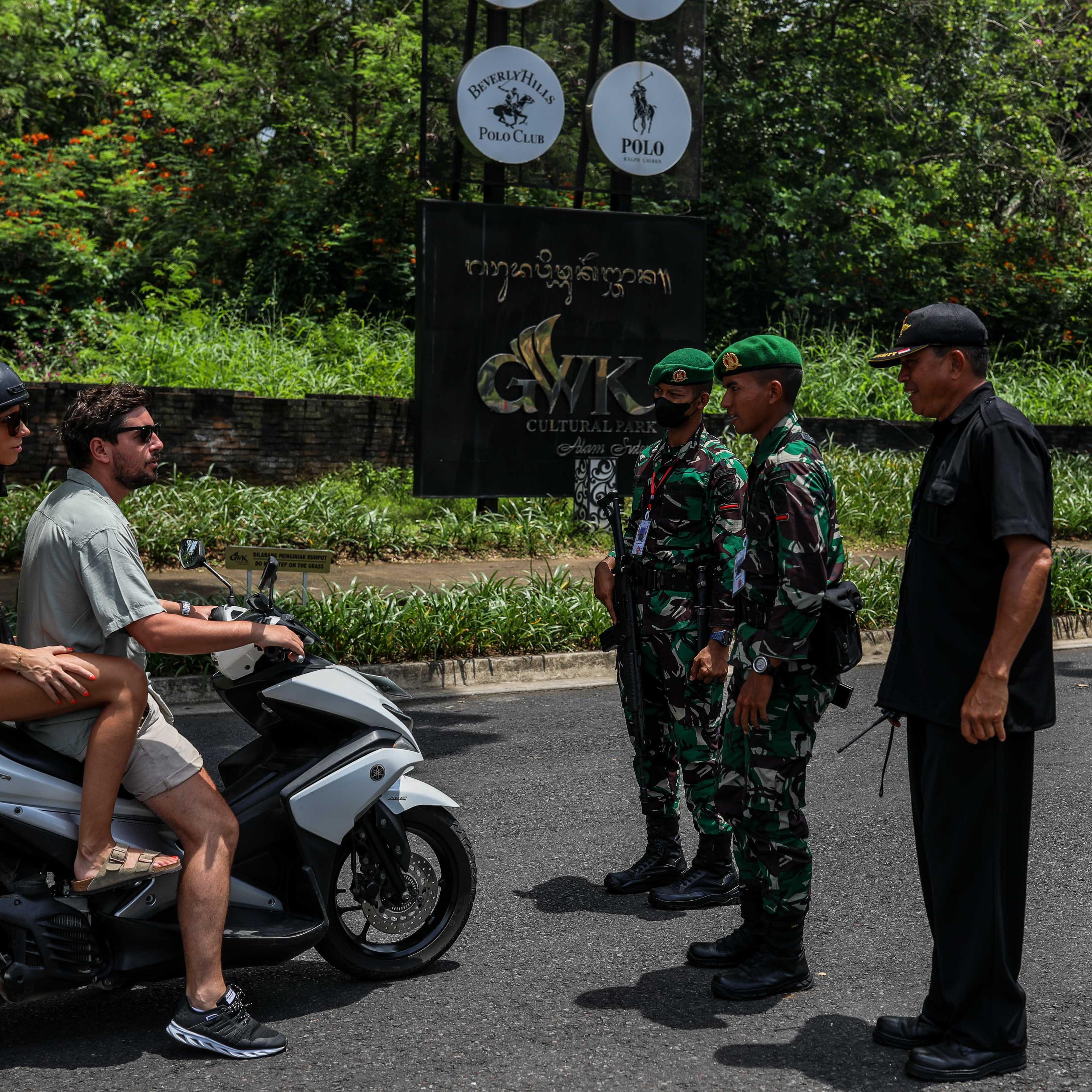 Bali police stop tourists on a motorbike