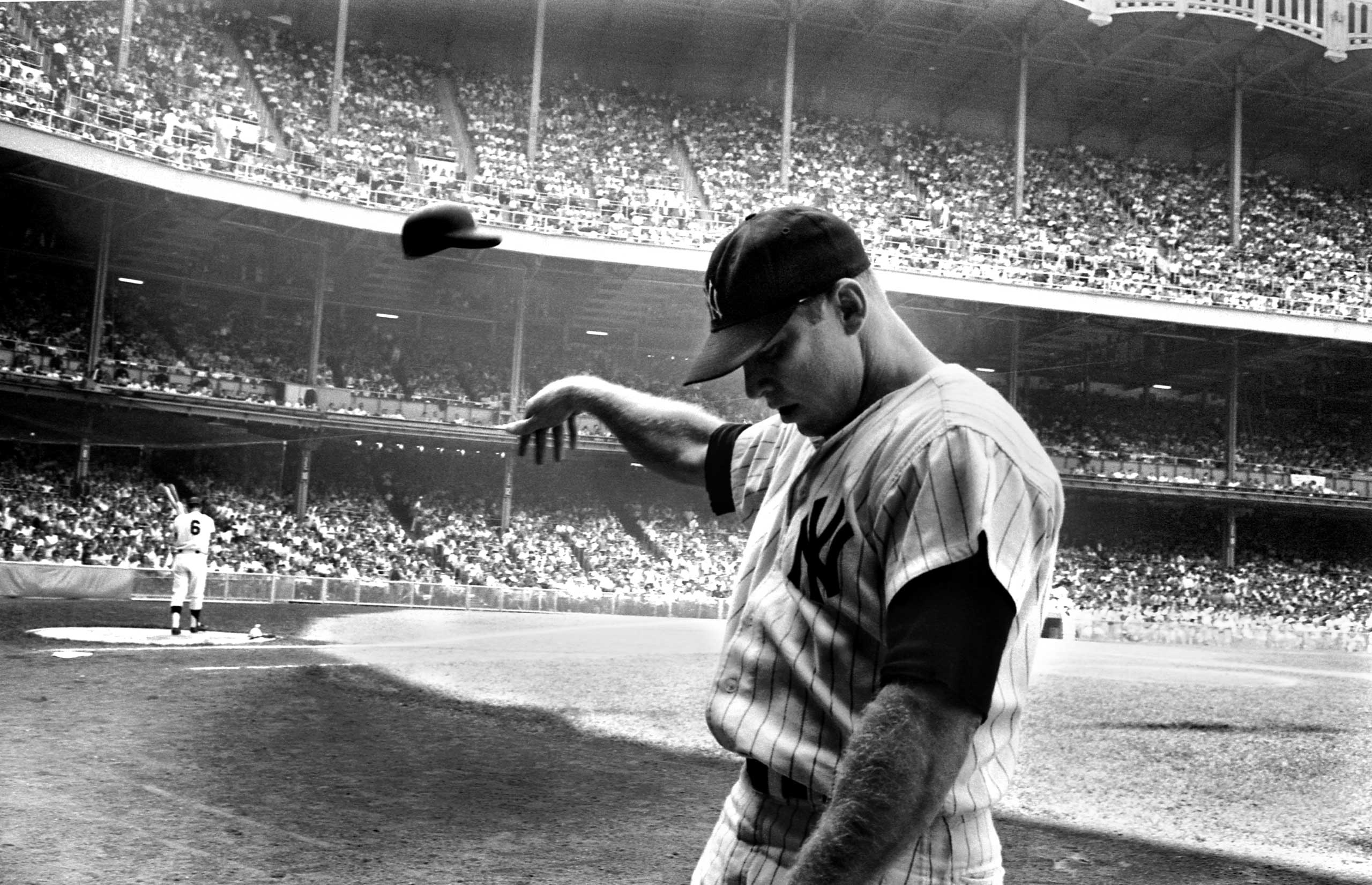 In one of the most eloquent photographs ever made of a great athlete in decline, Yankee star Mickey Mantle flings his batting helmet away in disgust after another terrible at-bat near the end of his storied, injury-plagued career. Originally published in