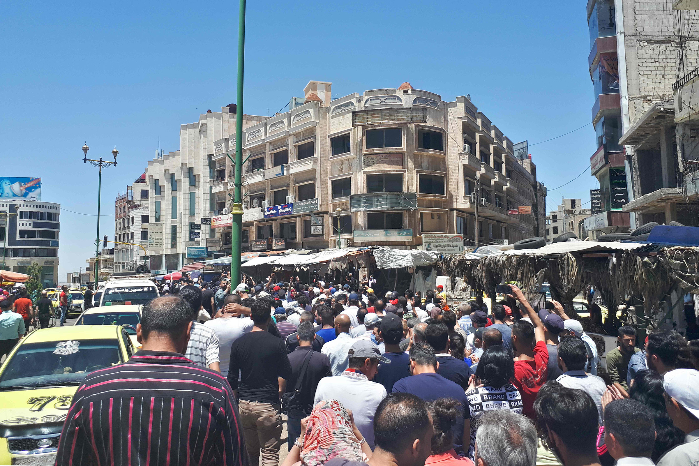 Protestors chant anti-government slogans in Suwaida, Syria on June 9, 2020.