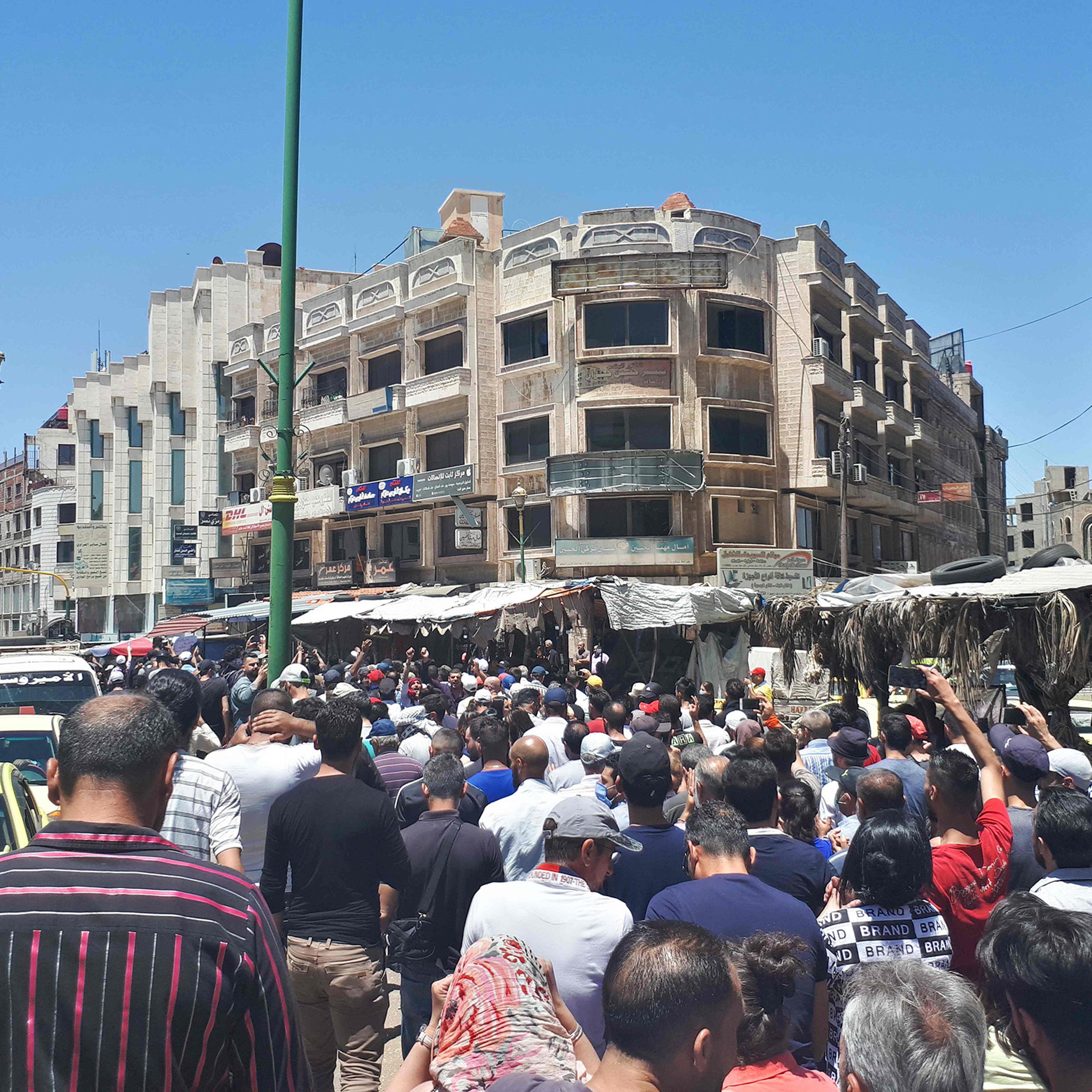 Protestors chant anti-government slogans in Suwaida, Syria on June 9, 2020.