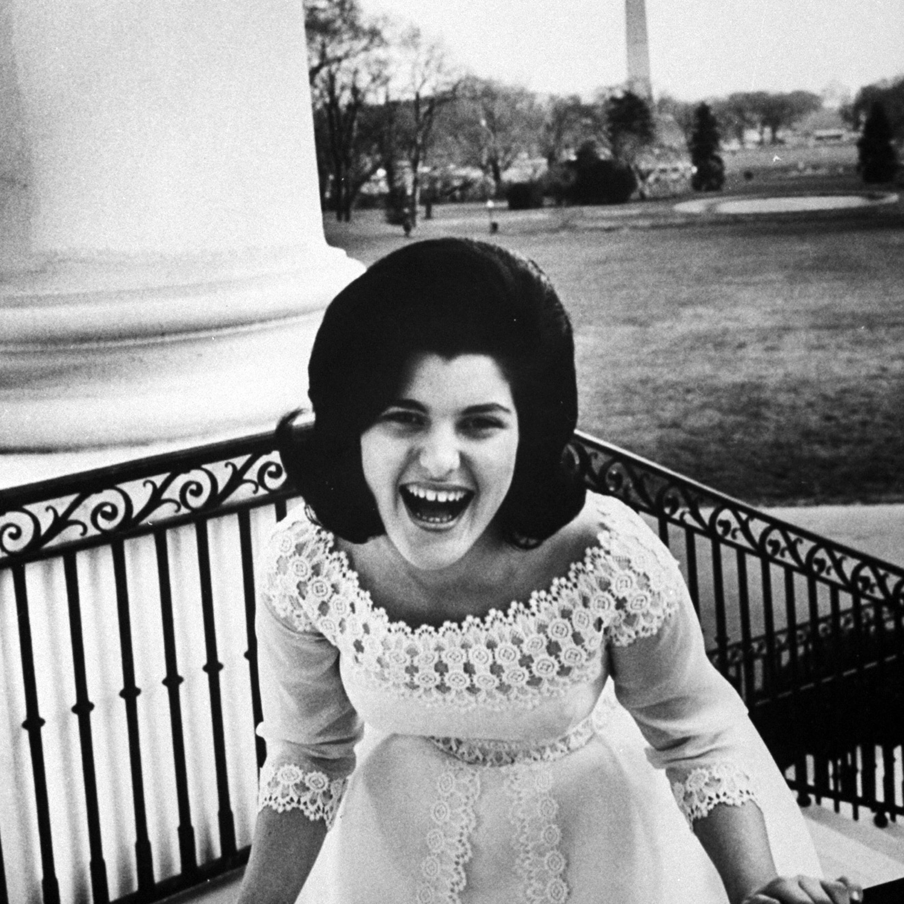 Dressed in new ball gown and laughing about a boy she knows, Luci Baines Johnson, 16, mounts the back-porch steps of her Pennsylvania home.