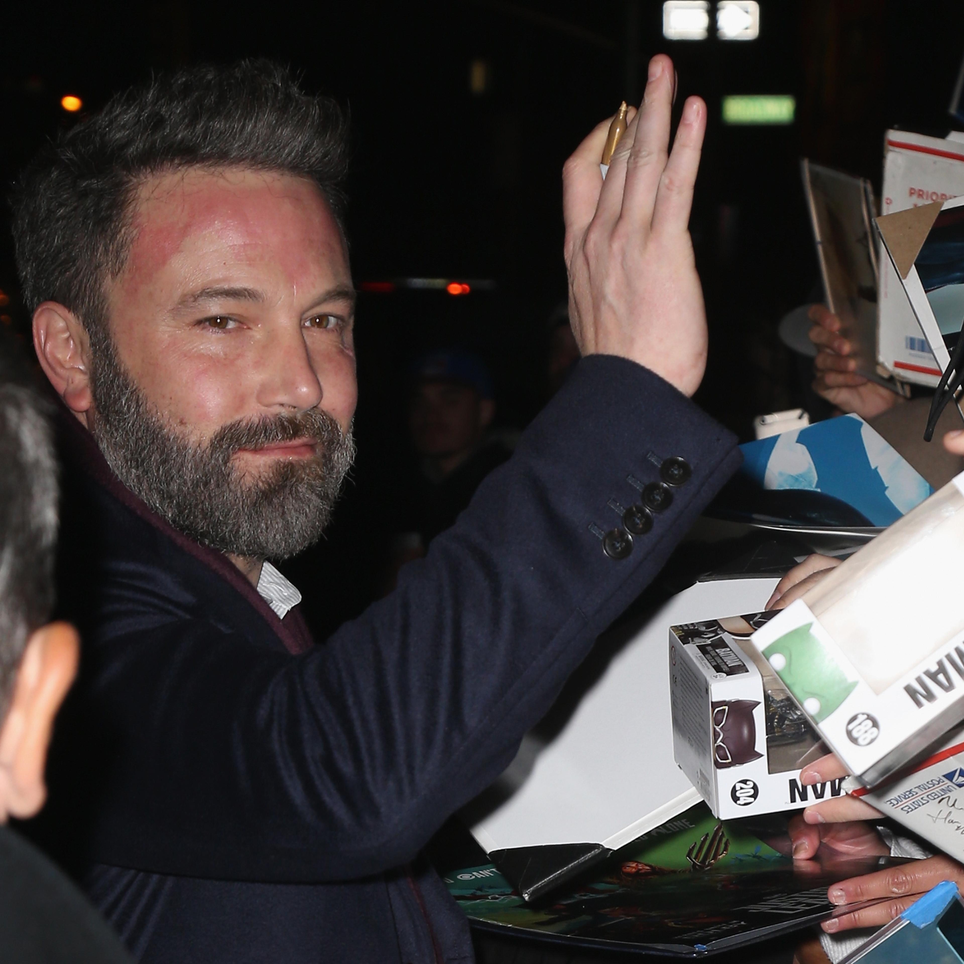 Ben Affleck signs autographs for fans as he departs Ed Sullivan Theater after his taping of 'The Late Show With Stephen Colbert 'on November 16, 2017 in New York City.