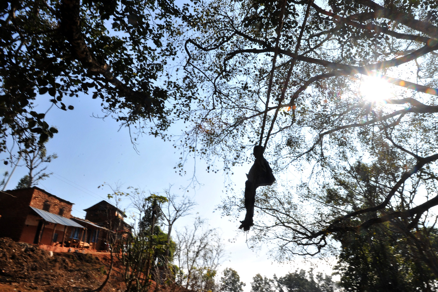 January 15, 2012. A young Nepalese plays on a swing during the Hindu festival of Maghesangranti at Taraka village, Nuwakot district, some 80 kilometers from Kathmandu.