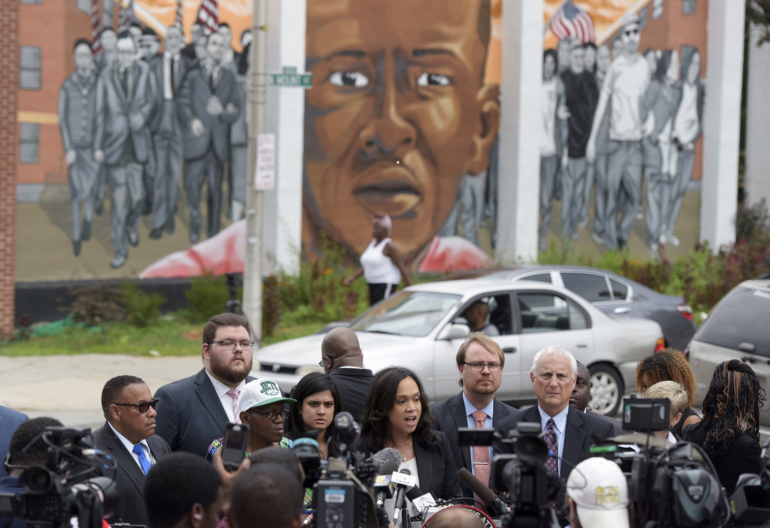 Baltimore State's Attorney Marilyn Mosby, center, speaks during a news conference after her office dropped remaining charges against the three Baltimore police officers who were still awaiting trial in Freddie Gray’ death, in Baltimore on July 27, 2016.