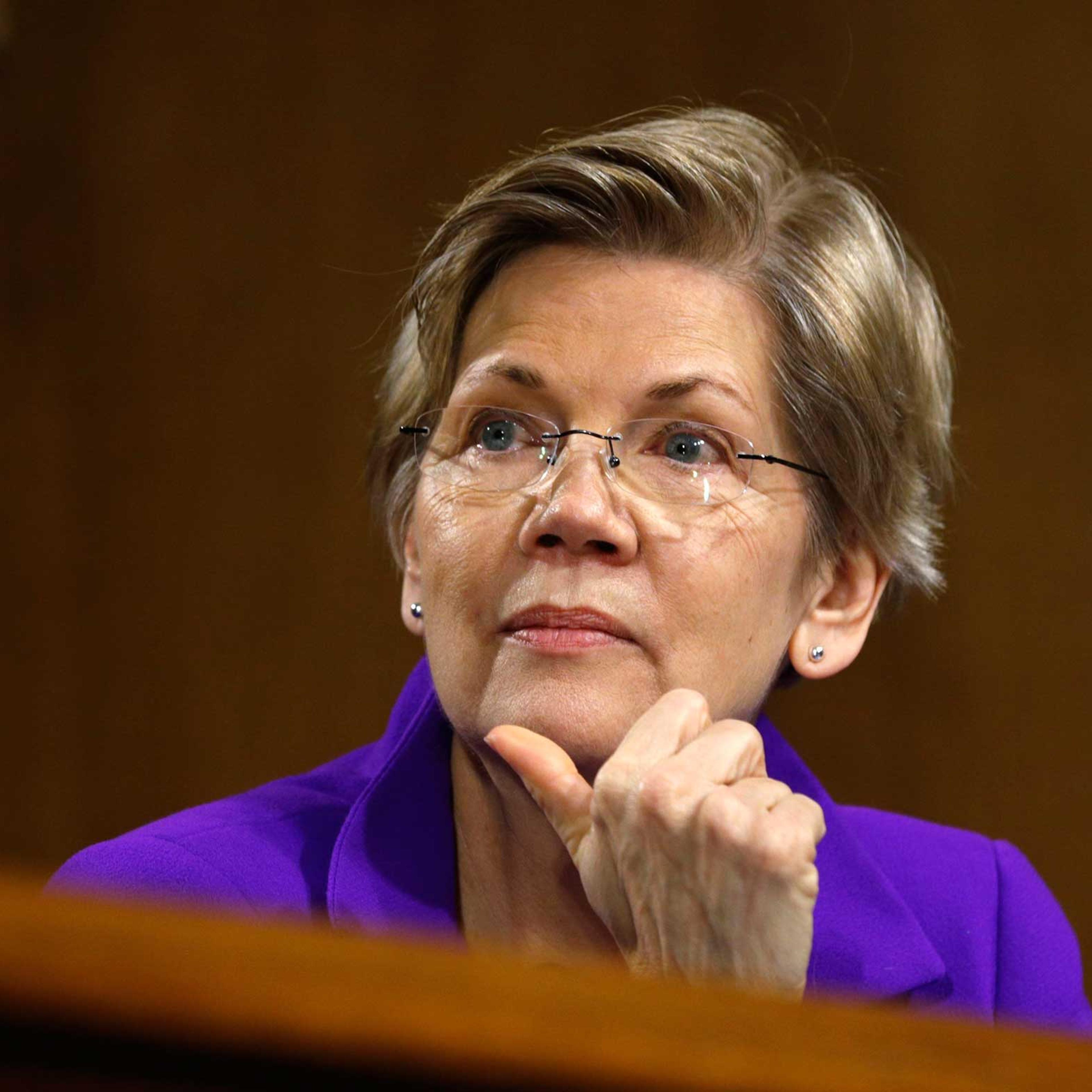 Sen. Elizabeth Warren listens to Federal Reserve Chair Janet Yellen testify, at a Senate Banking, Housing and Urban Affairs Committee hearing on "Semiannual Monetary Policy Report to Congress" on Capitol Hill in Washington, Feb. 24, 2015.