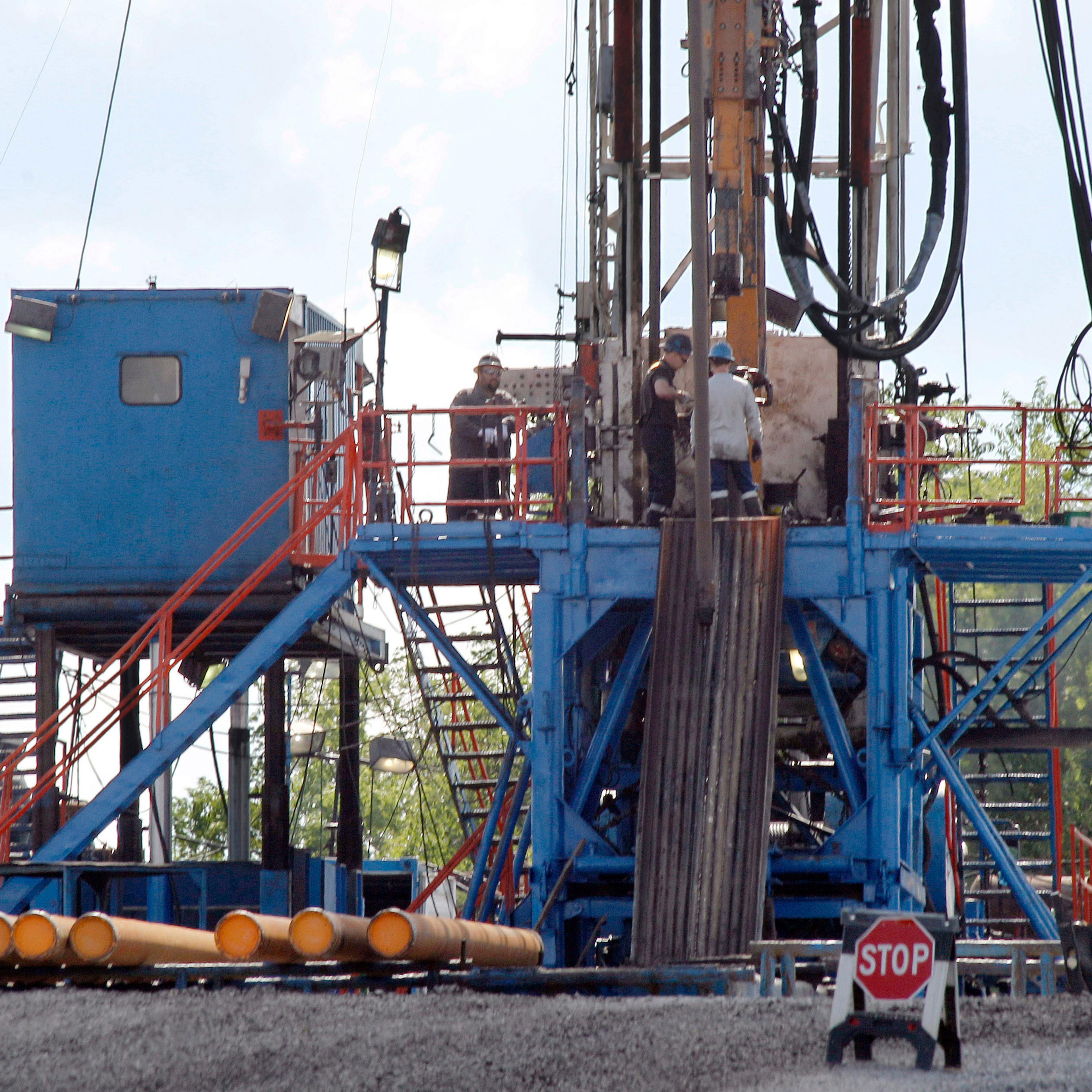 A crew works on a gas drilling rig at a well site for shale based natural gas in Zelienople, Pa on Feb. 28. 2013.