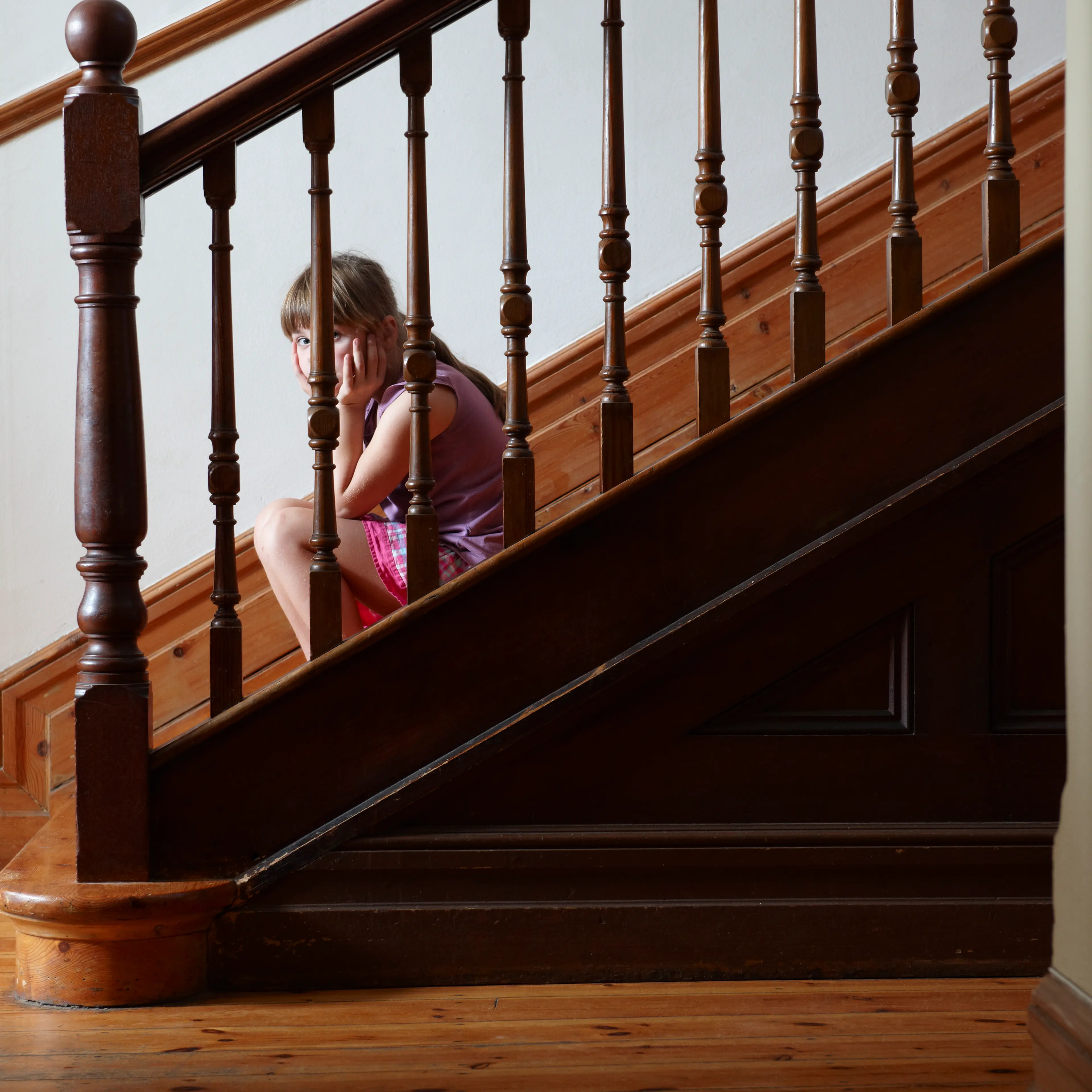 Lonely girl sitting on steps