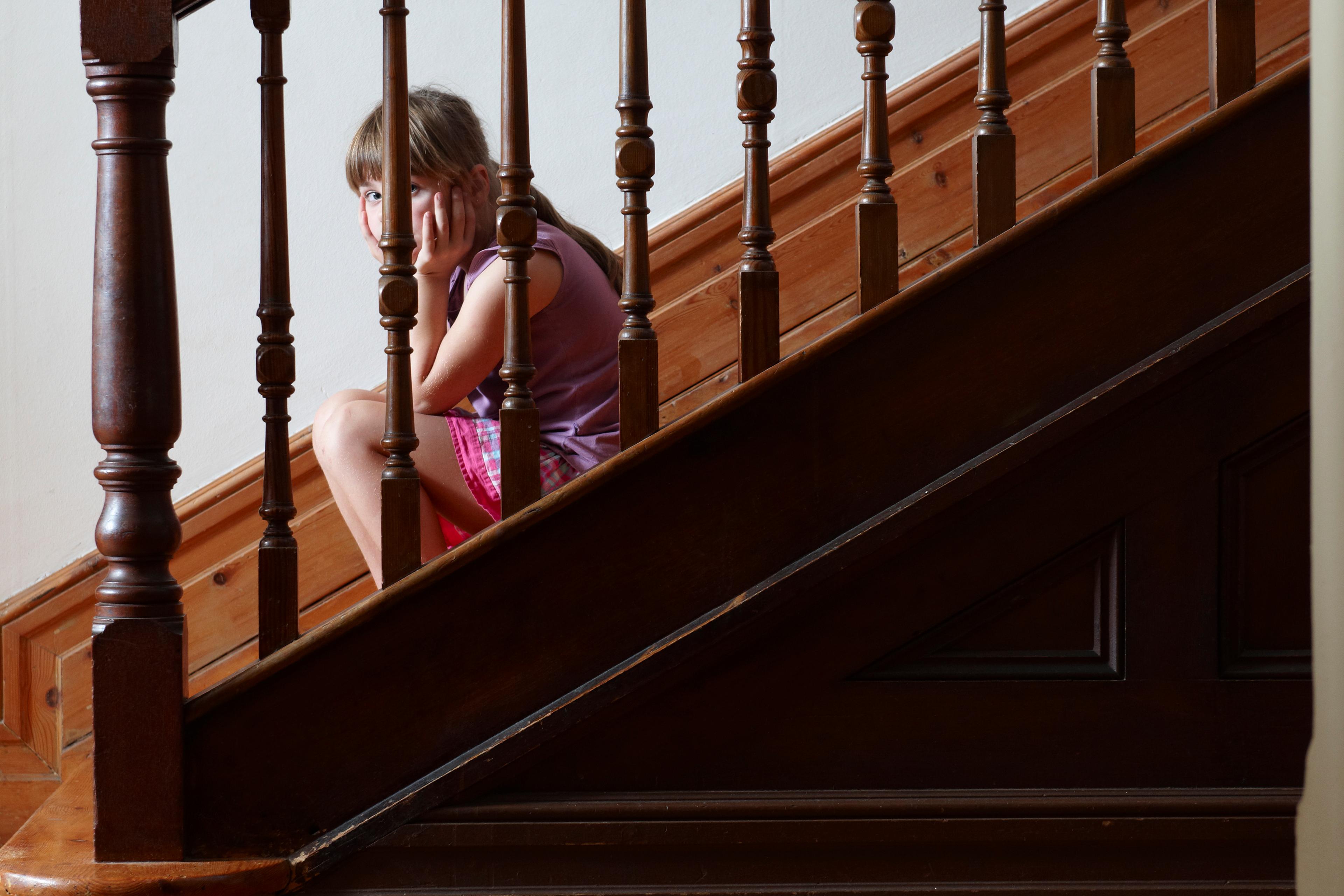 Lonely girl sitting on steps