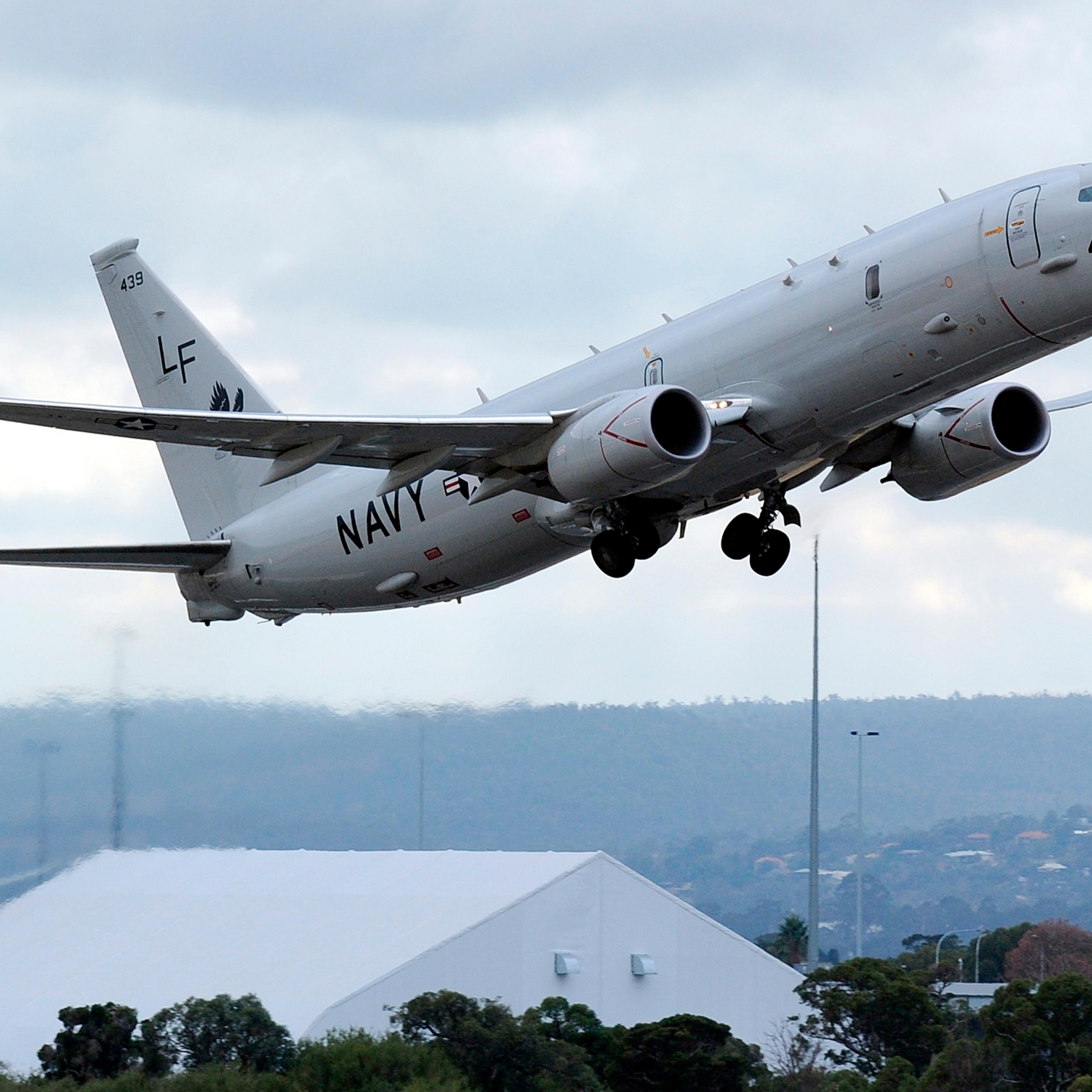 A U.S. Navy P-8 Poseidon aircraft takes off from Perth International Airport to participate in the search for the missing Malaysian Airlines flight MH370