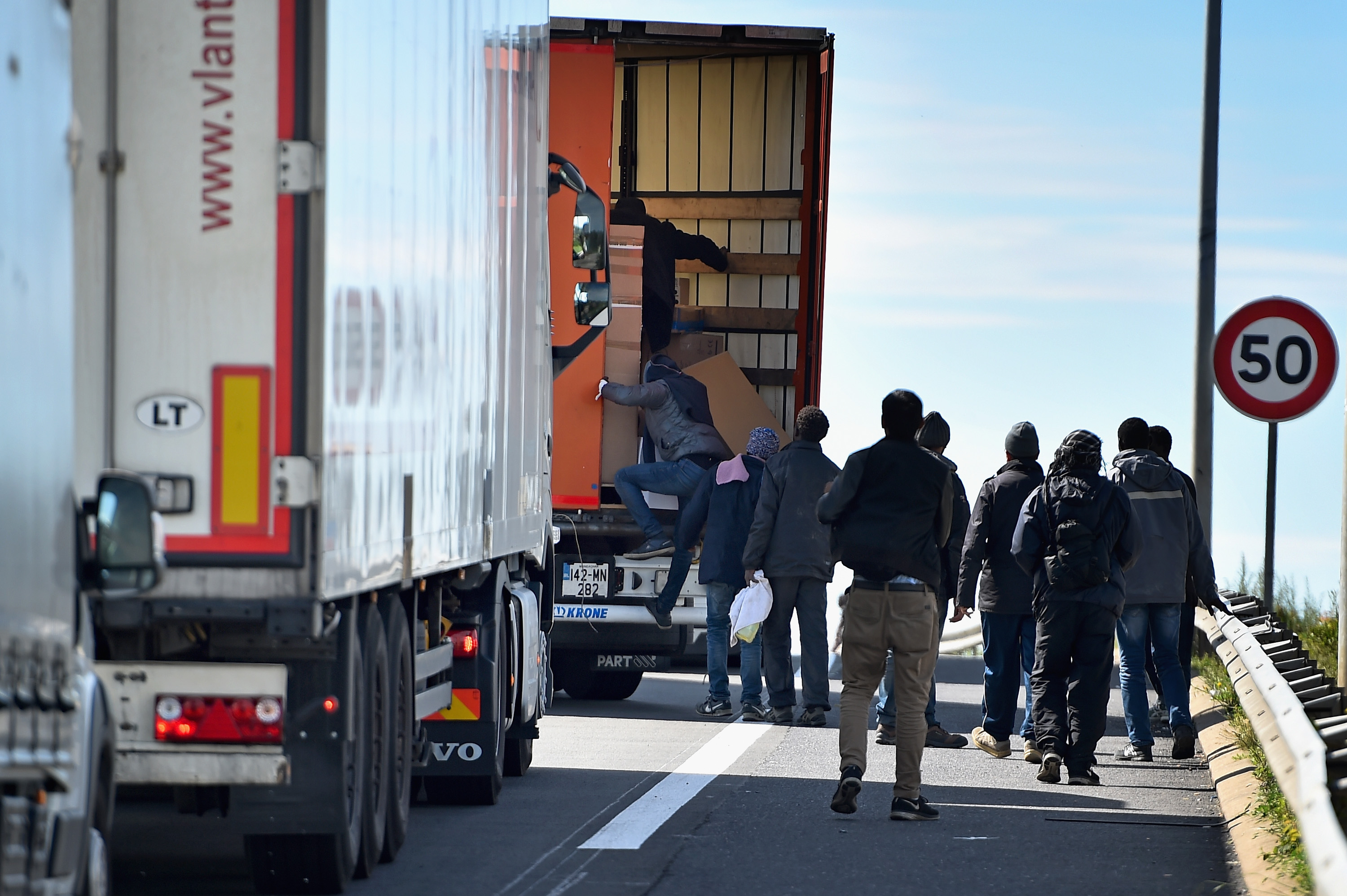 Migrants continue to try and board lorries bound for the United Kingdom on June 25, 2015 in Calais, France.