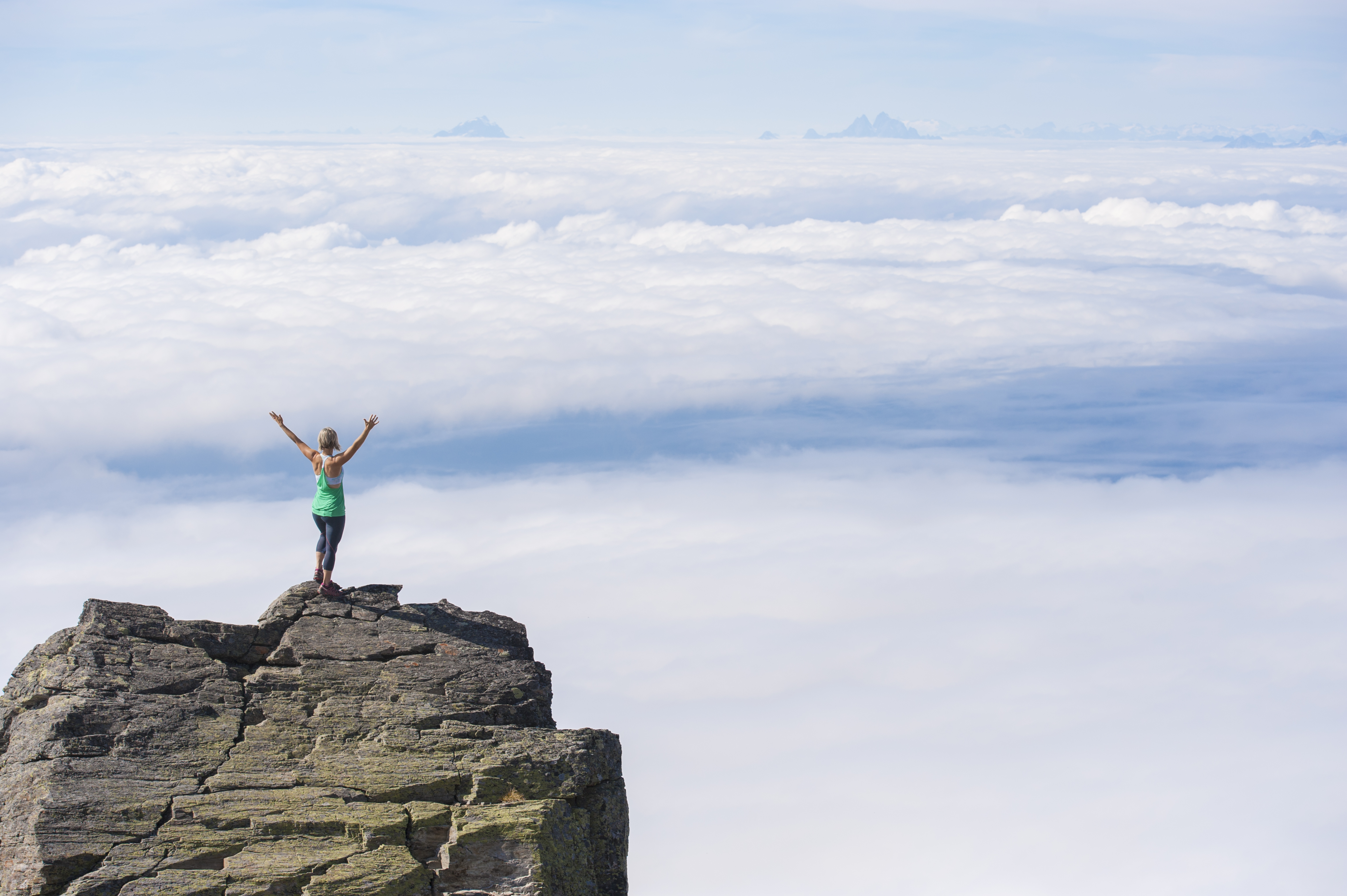 woman-standing-above-clouds