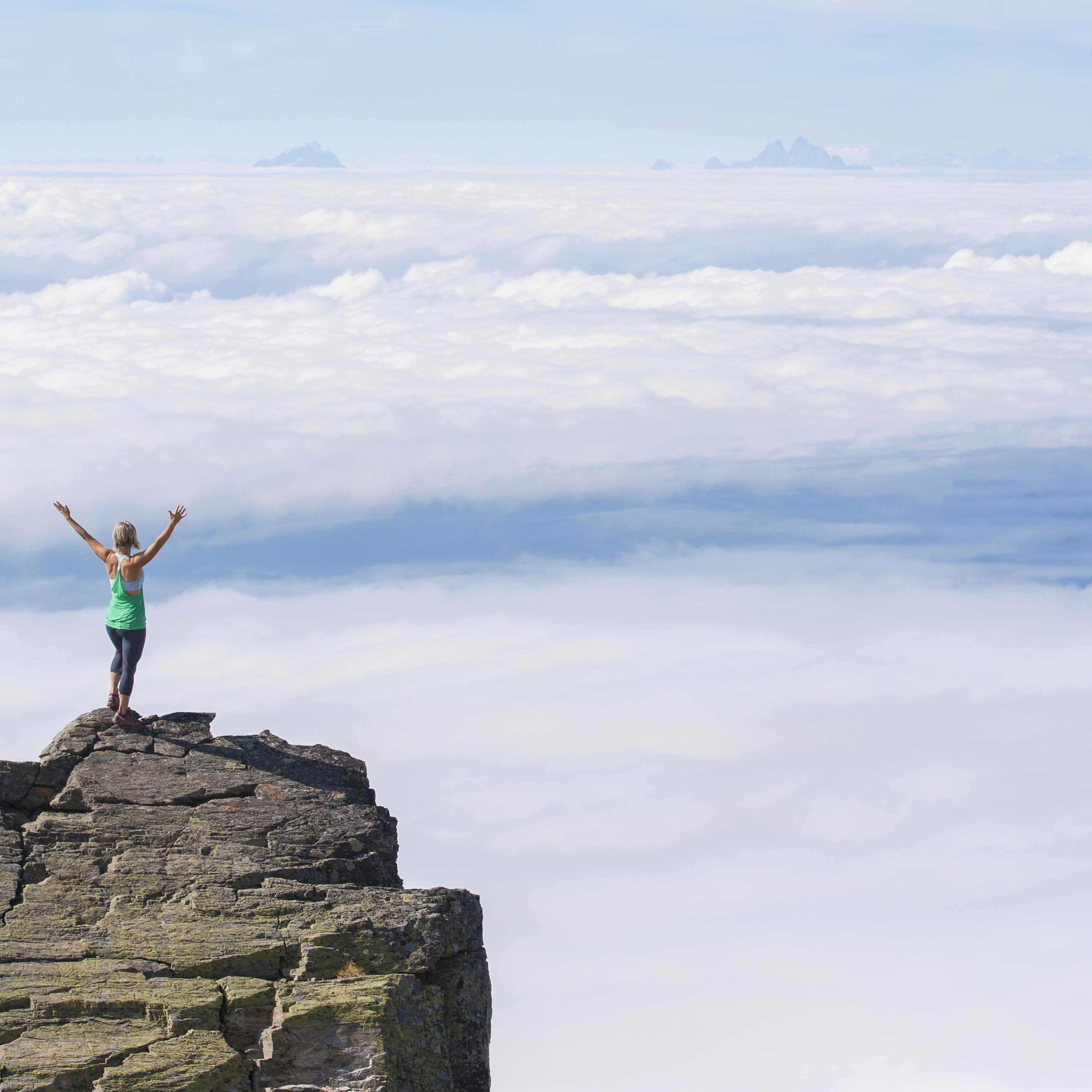 woman-standing-above-clouds