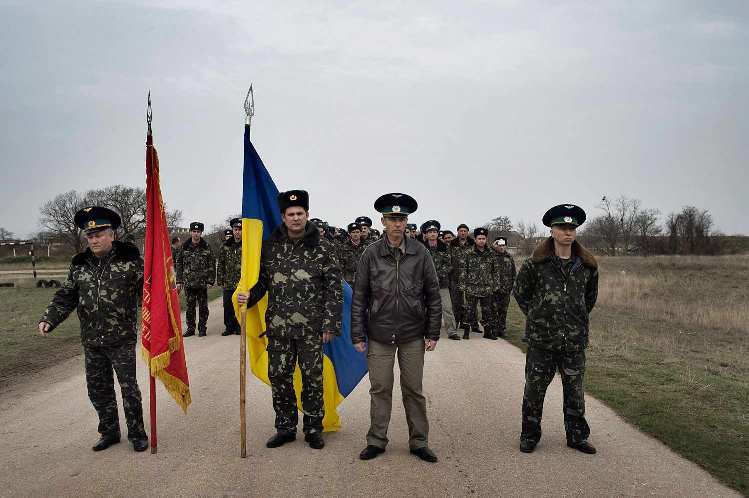 Unnarmed Ukrainian soldiers approach Russian positions on the perimeter of the contested Belbek airfield in Crimea to press demands to return to their positions there and conduct joint patrols,March ,4 2014.