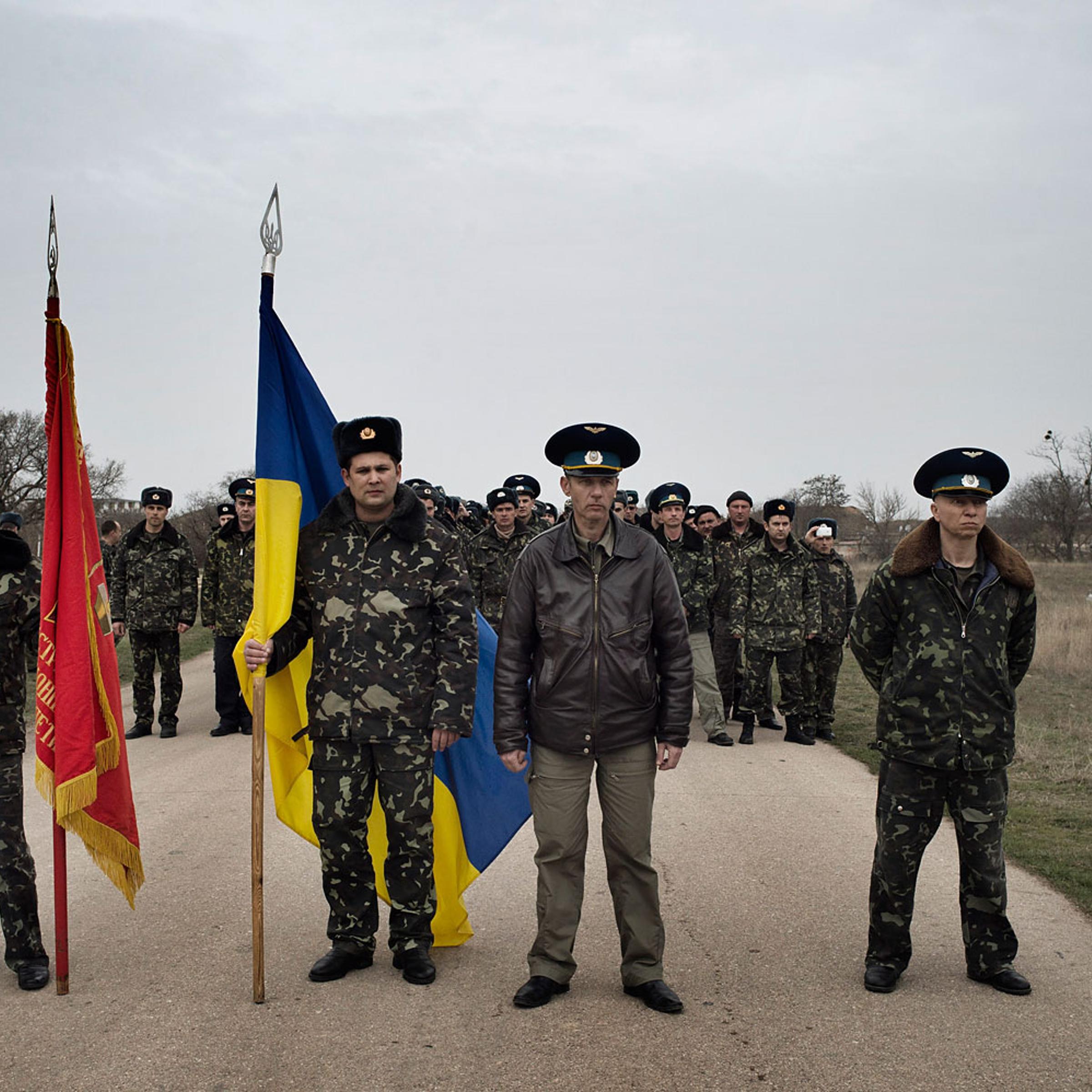 Unnarmed Ukrainian soldiers approach Russian positions on the perimeter of the contested Belbek airfield in Crimea to press demands to return to their positions there and conduct joint patrols,March ,4 2014.