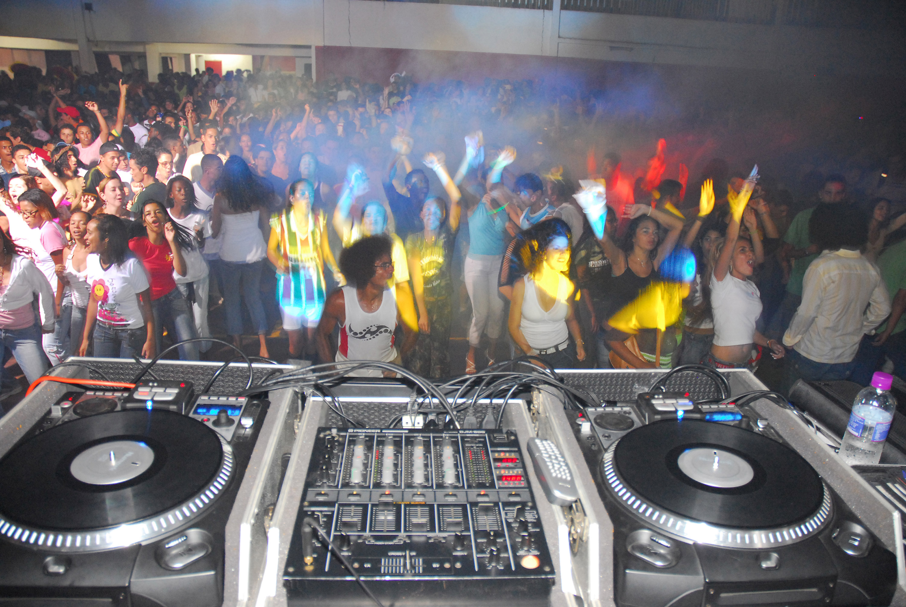 Young people jam the gym floor of a social club for a Gospel