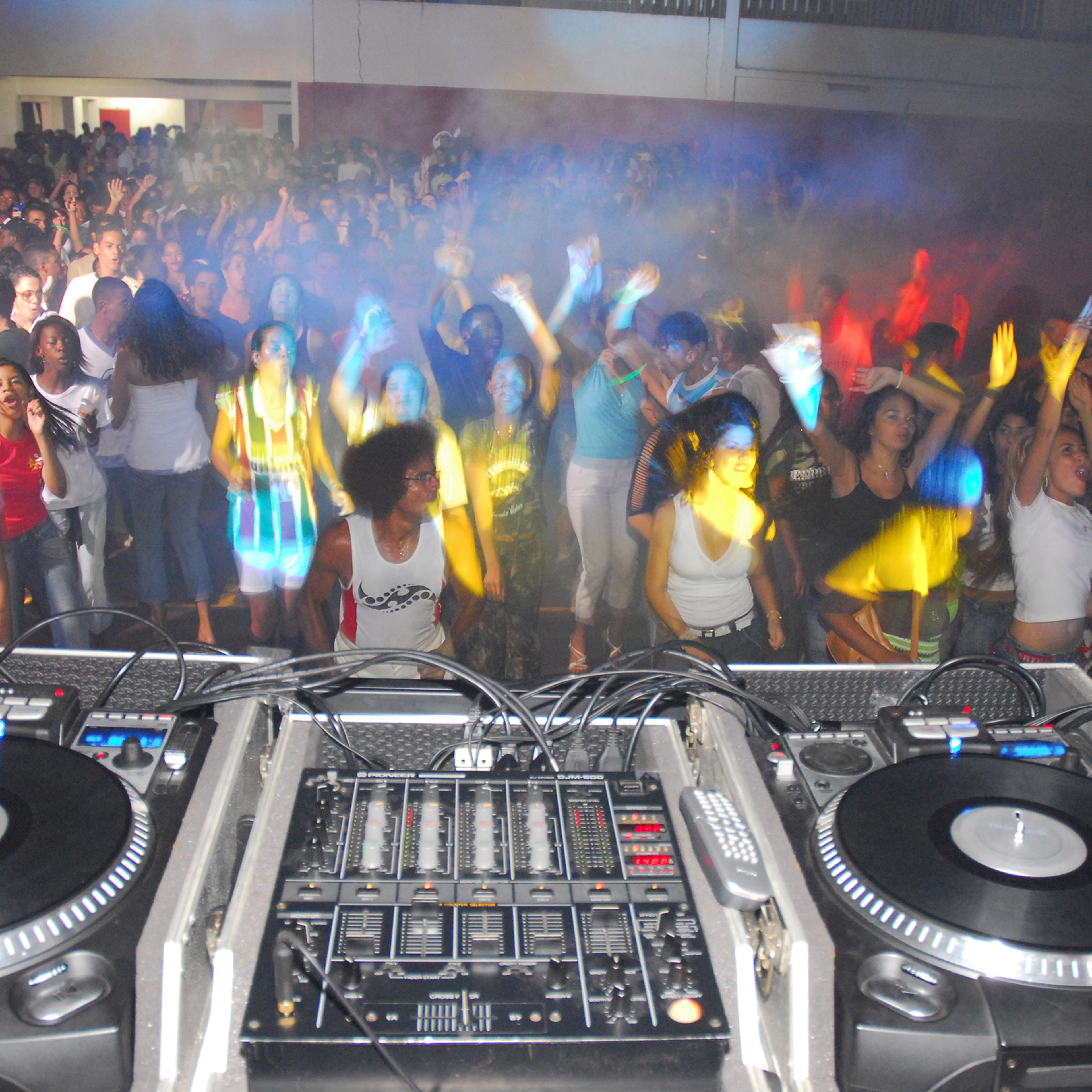 Young people jam the gym floor of a social club for a Gospel