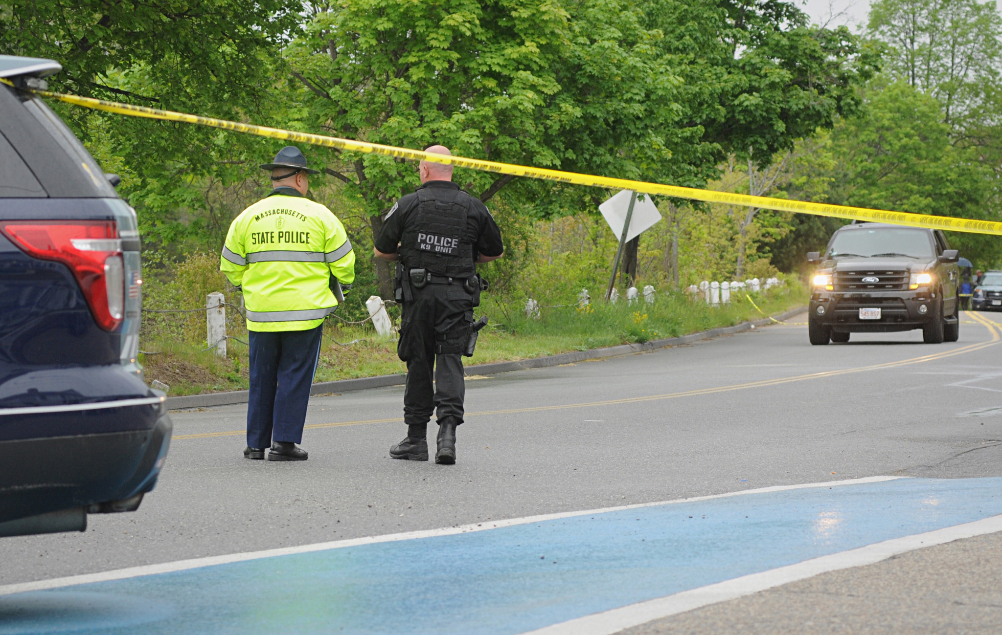 Police guard the scene on Rochdale Street near Zabelle Ave where an Auburn Police officer was shot Sunday morning May 22, 2016, in Auburn, Mass. Massachusetts State Police say in a statement that an Auburn police officer was shot at about 12:30 a.m. Sund
