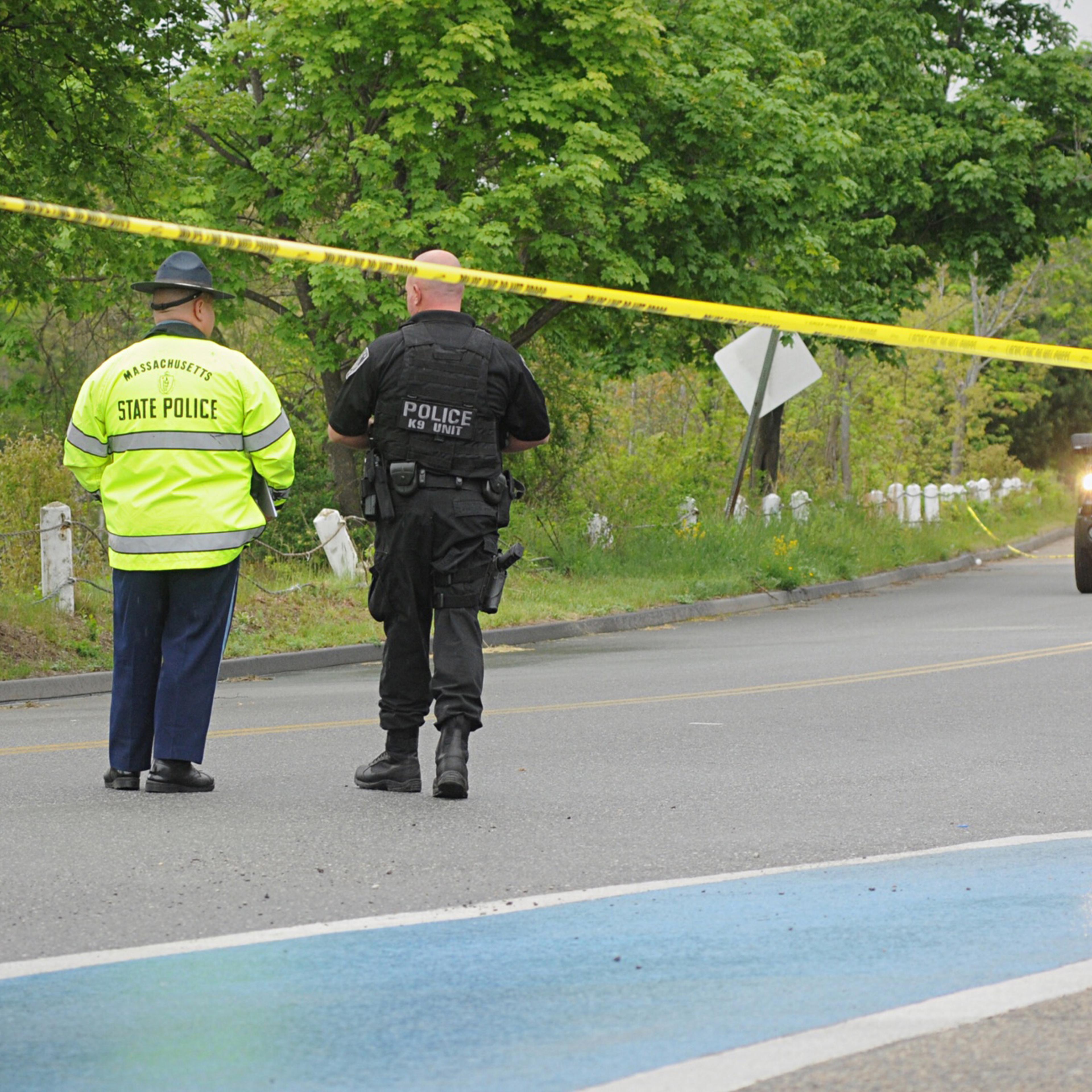 Police guard the scene on Rochdale Street near Zabelle Ave where an Auburn Police officer was shot Sunday morning May 22, 2016, in Auburn, Mass. Massachusetts State Police say in a statement that an Auburn police officer was shot at about 12:30 a.m. Sund
