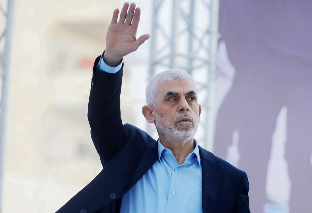 Yahya Sinwar, head of the Palestinian Islamic movement Hamas in the Gaza Strip, waves his hand to the crowd during the celebration of International Quds Day in Gaza City.