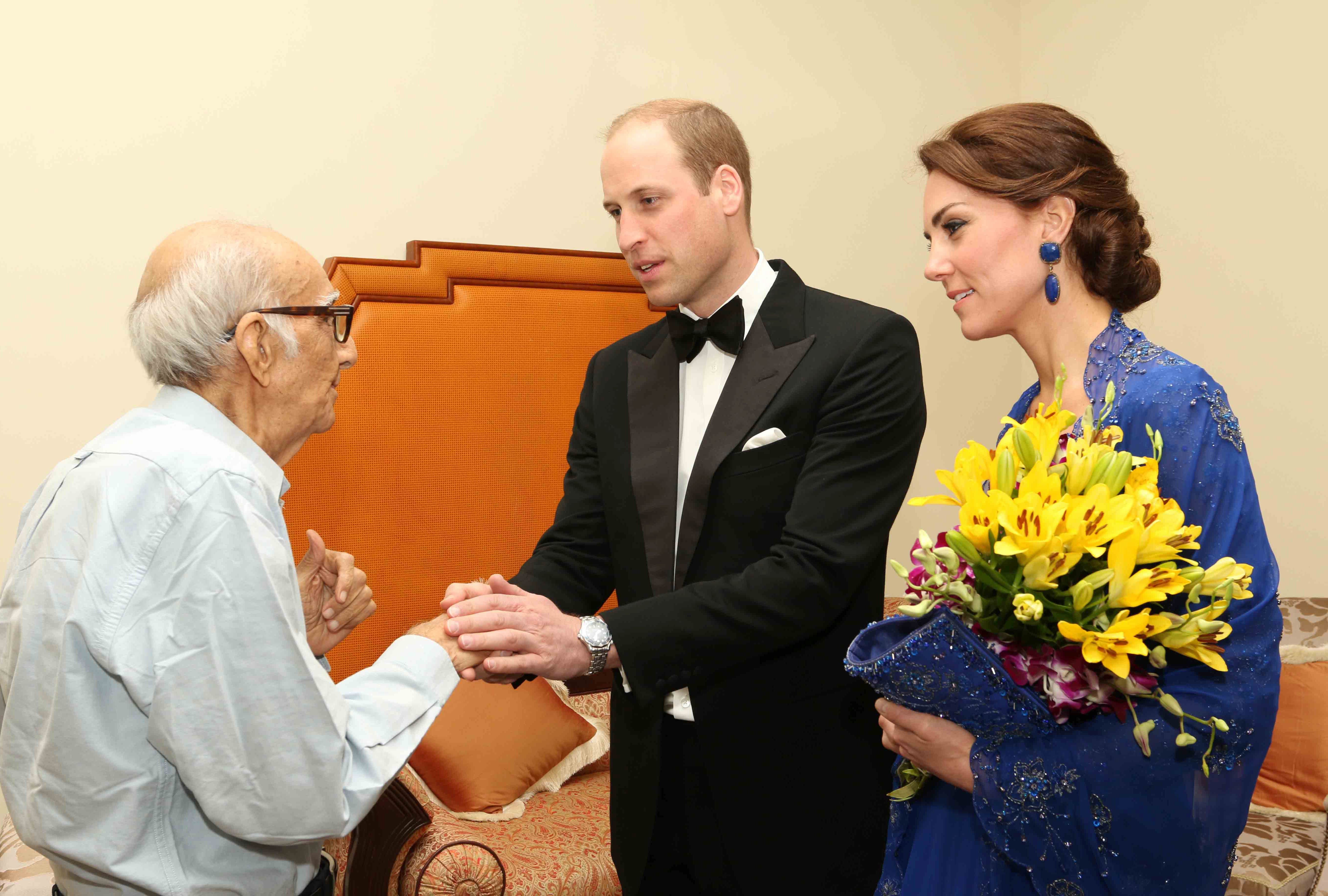 Prince William, Duke of Cambridge and Catherine, Duchess of Cambridge speak with Boman Kohinoor during a meeting in Mumbai on April 10, 2016. Kohinoor, 93, has a strong claim to be India's biggest fan of the British royal family.