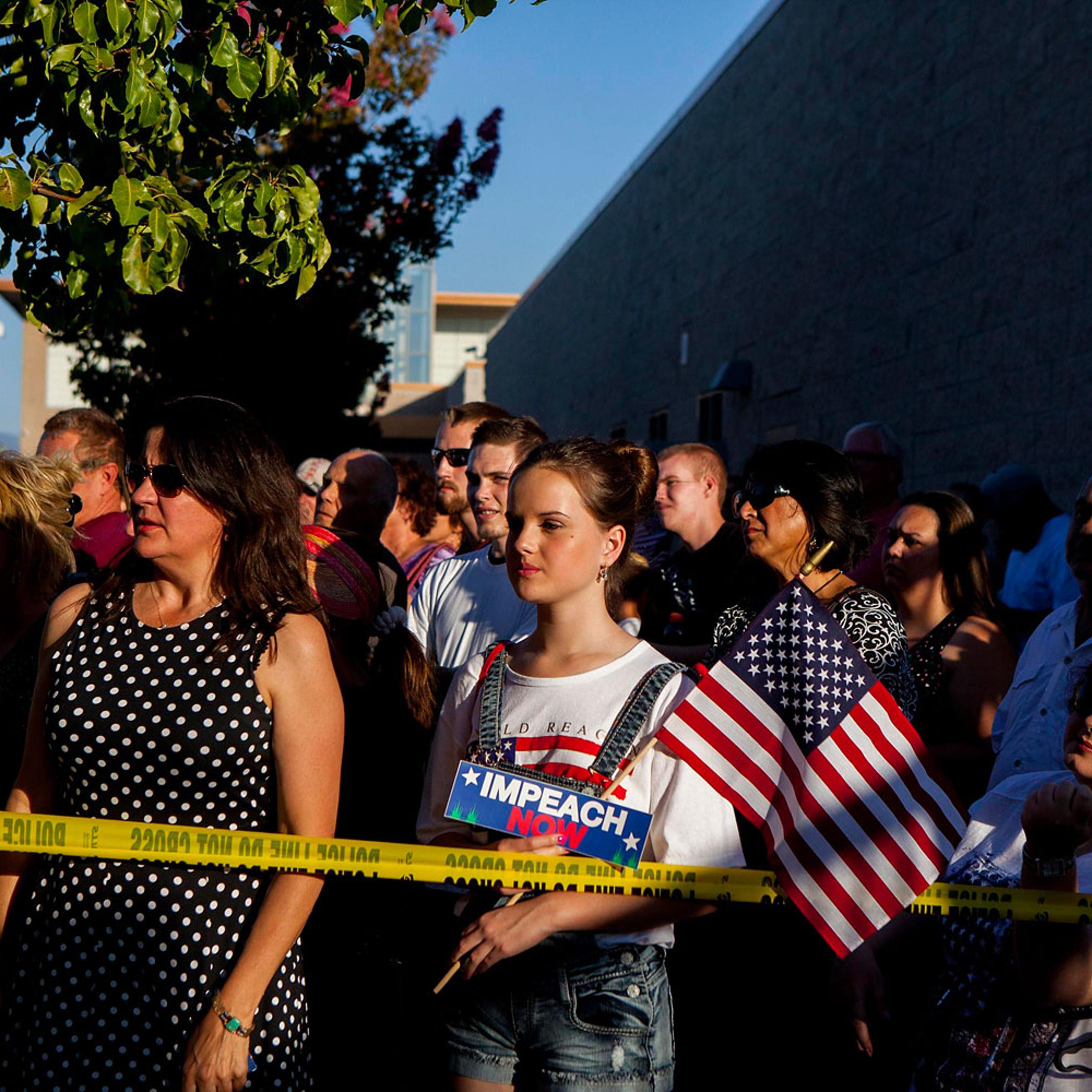 Residents and protestors attend a town hall meeting to discuss the processing of undocumented immigrants in Murrieta, California