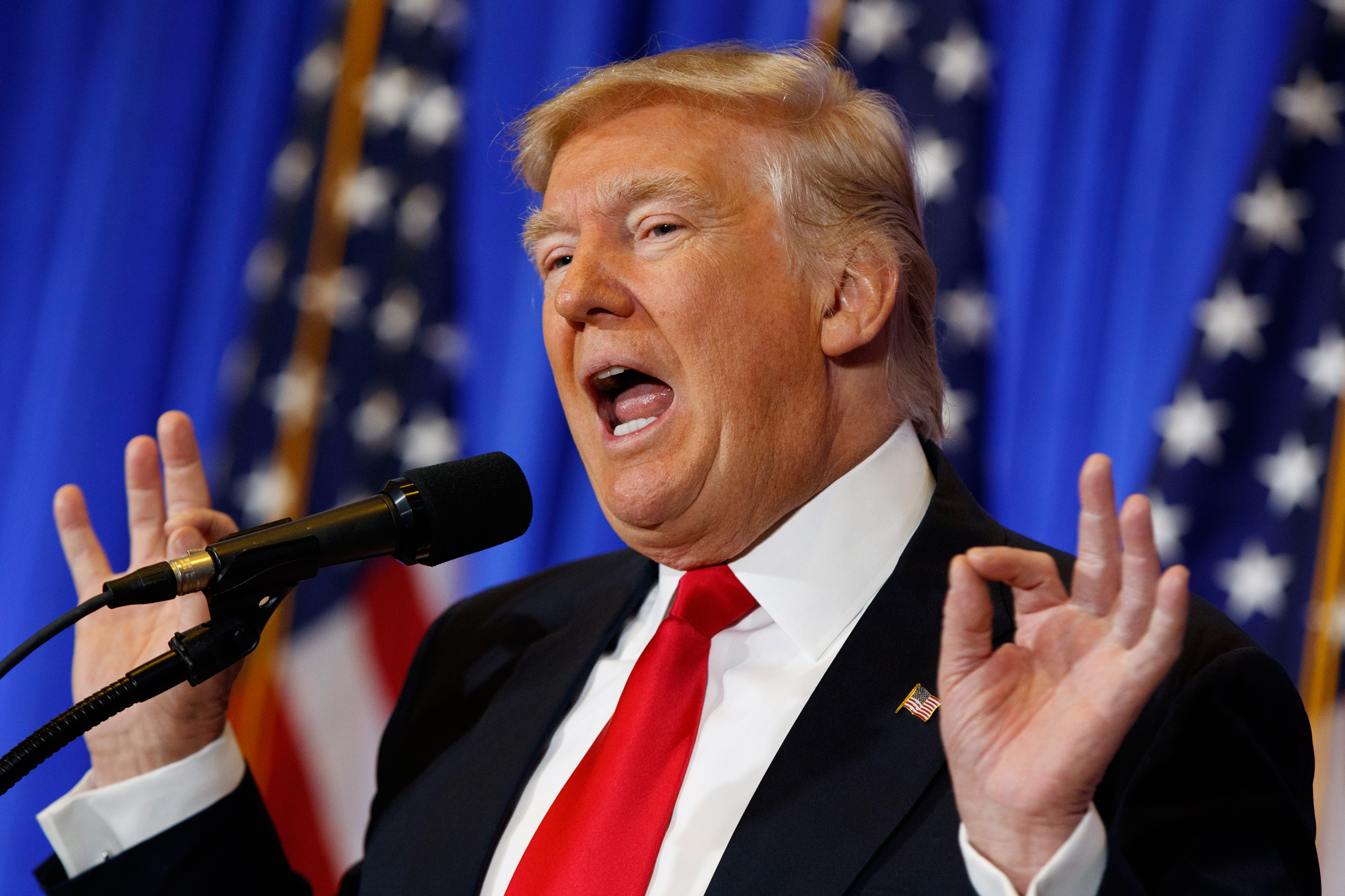 FILE - In this Jan. 11, 2017 file photo, President-elect Donald Trump speaks during a news conference in the lobby of Trump Tower in New York. Trump says his team will have a “full report on hacking within 90 days,” and is again dismissing as fake a docu