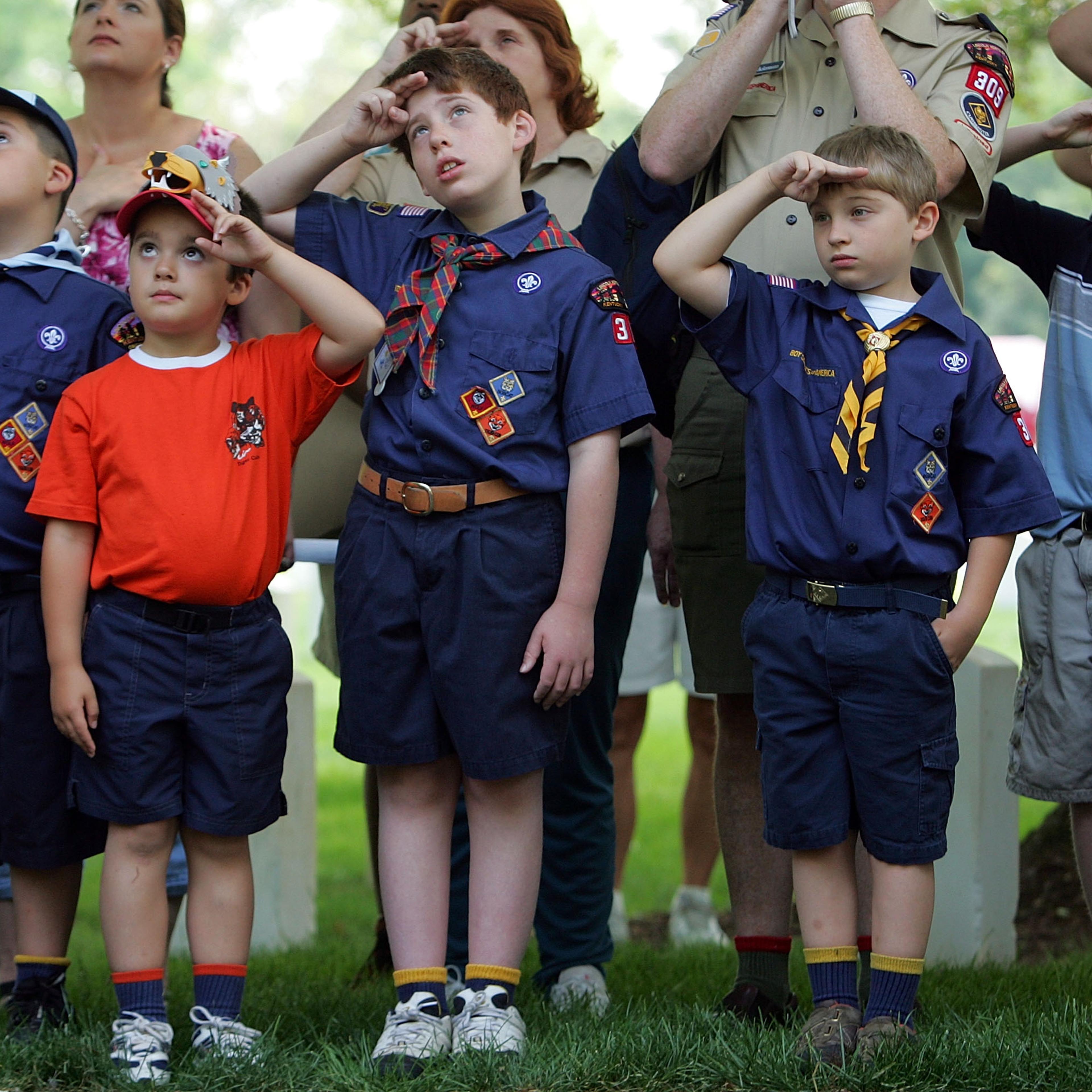 Boy Scouts Plant Flags At Cemetery For Memorial Day