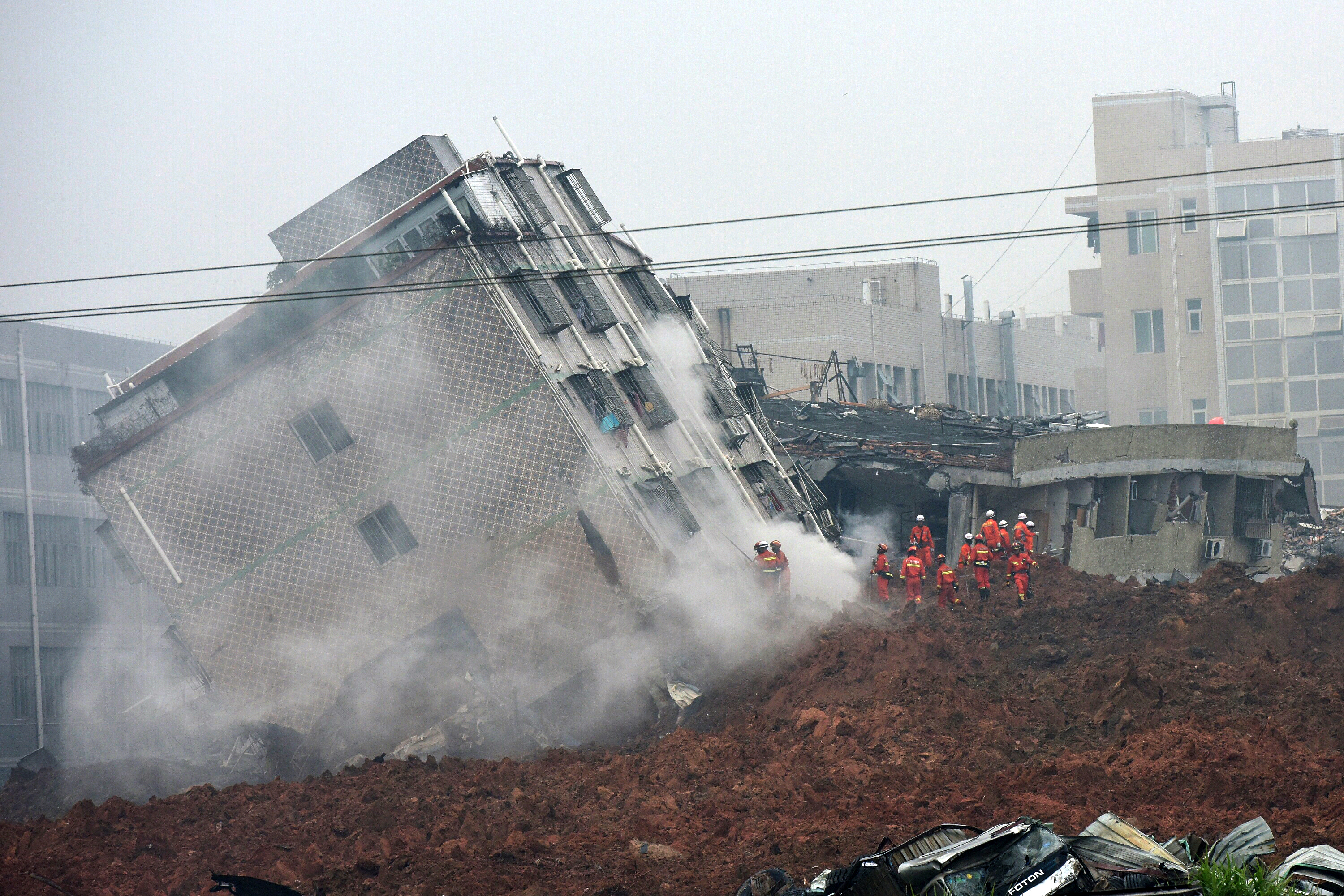 Rescuers search for survivors on a collapsed building following a landslide in Shenzhen, in south China's Guangdong province, on Dec. 20, 2015.