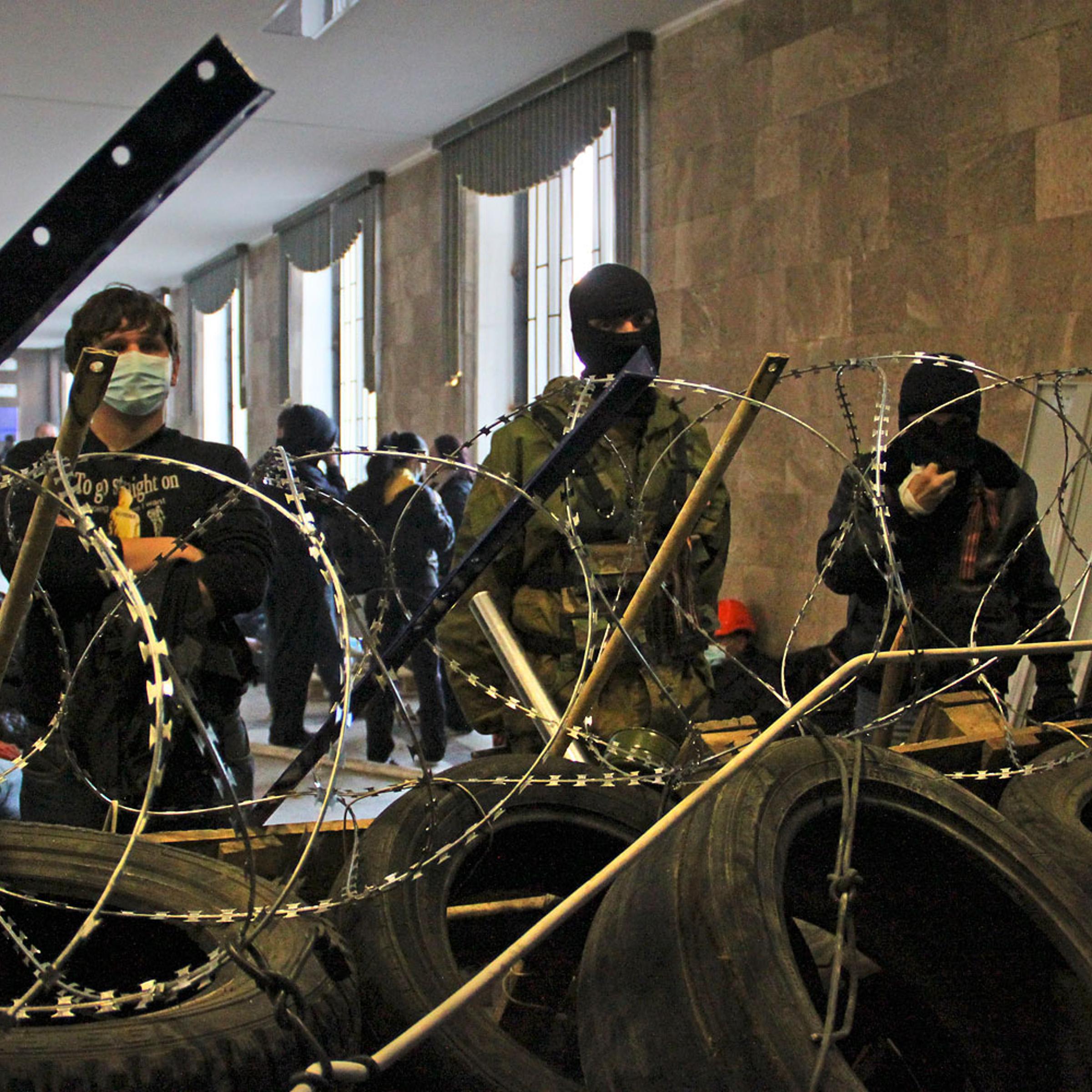 Activists prepare a barricade inside the regional administration building in Donetsk, Ukraine, April 7, 2014.