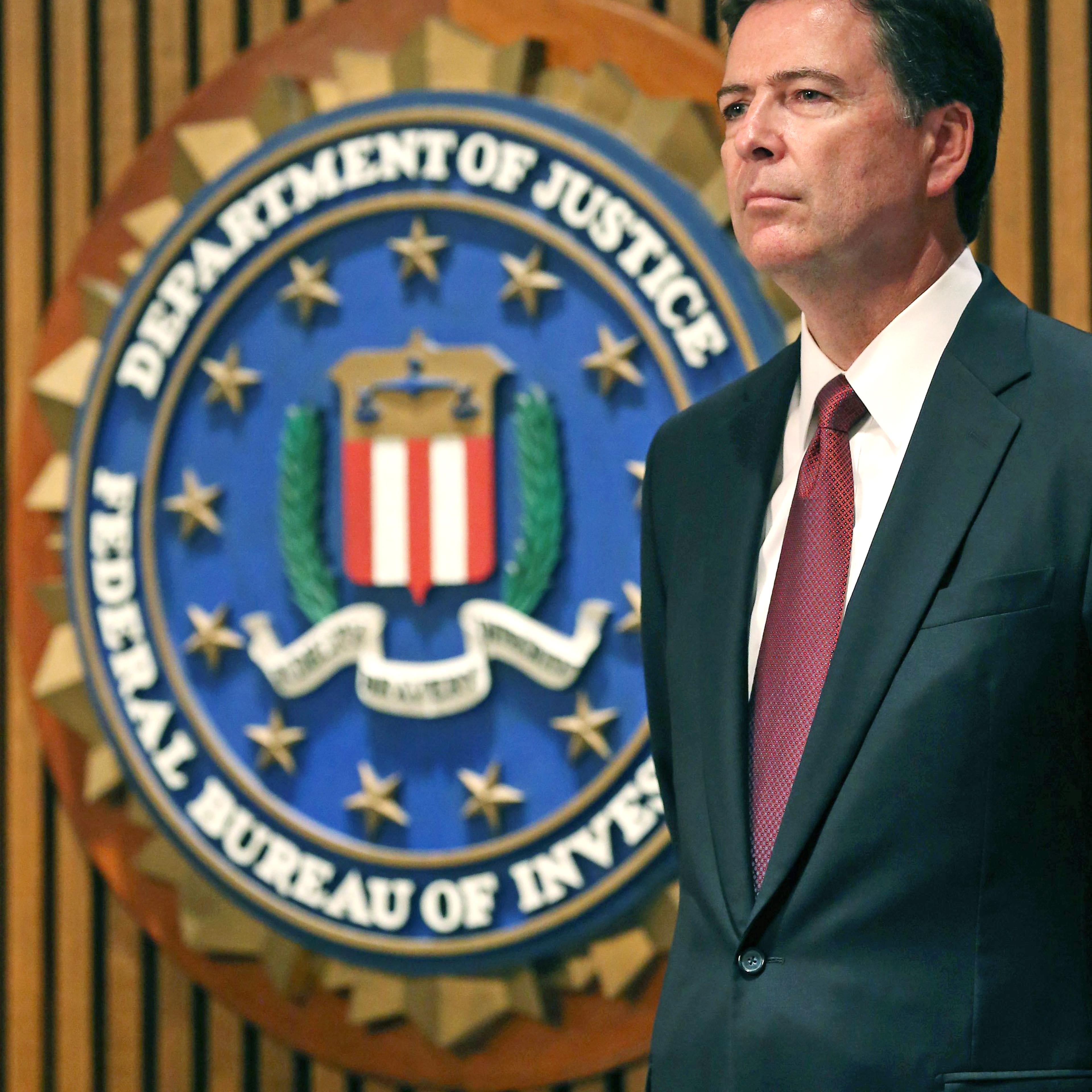 FBI Director James Comey participates in a news conference on child sex trafficking, at FBI headquarters, June 23, 2014 in Washington, D.C.