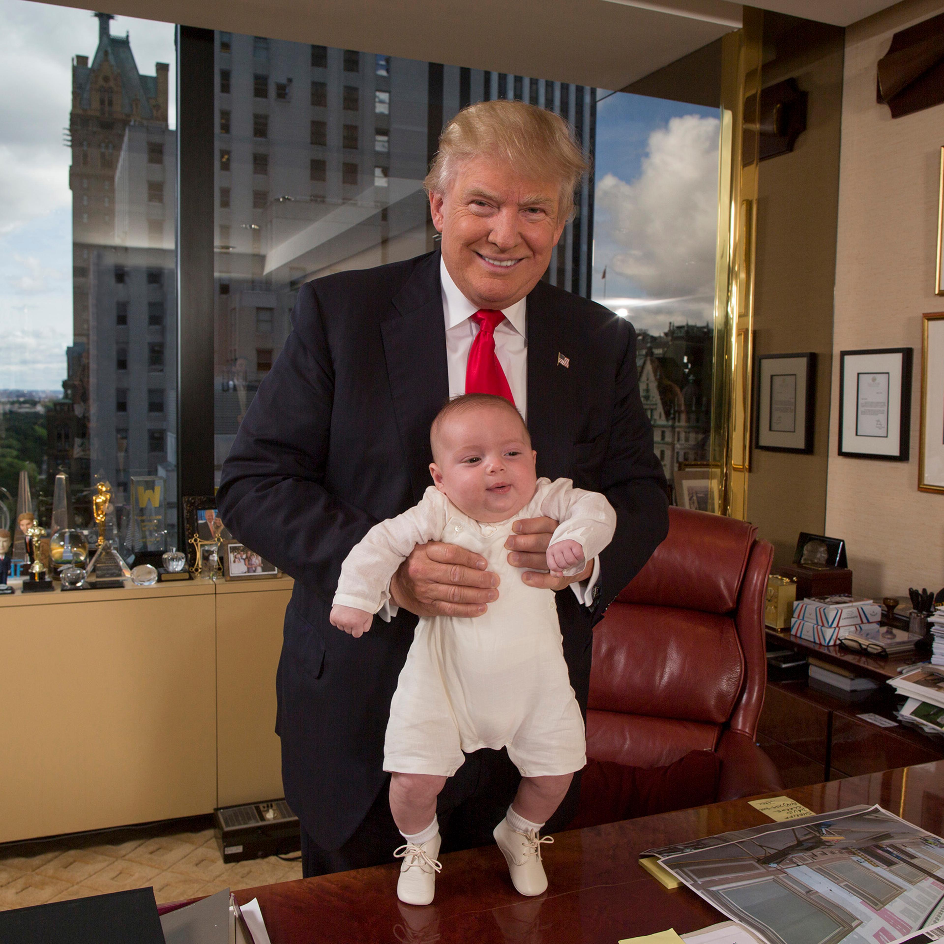 Republican presidential candidate Donald Trump with his grandson Theodore James in Trump’s office in New York City on July 11, 2016.