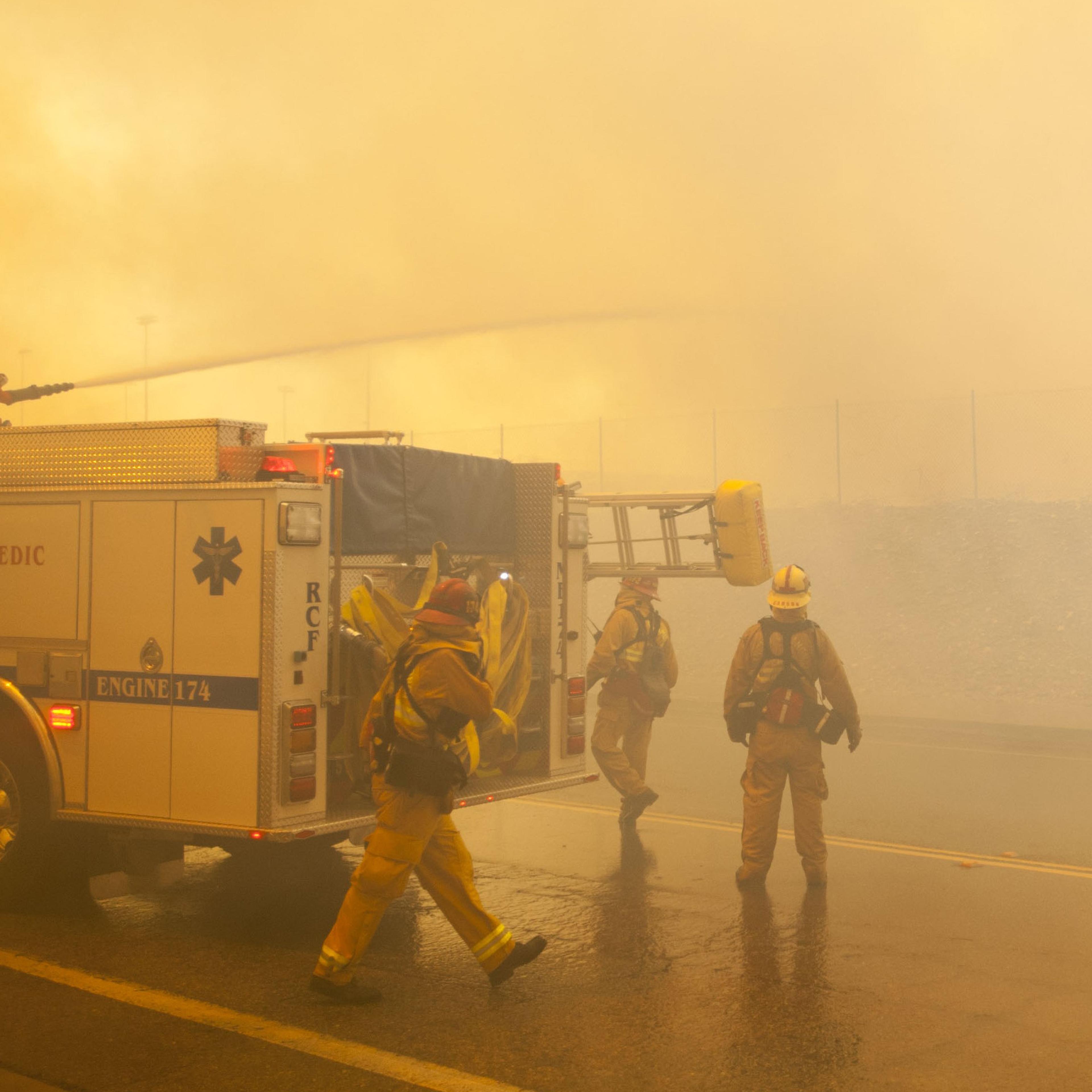 A fire crew uses their deck gun to cut down an aggressive branch of the Etiwanda Fire in Rancho Cucamonga, Calif., on April 30, 2014.