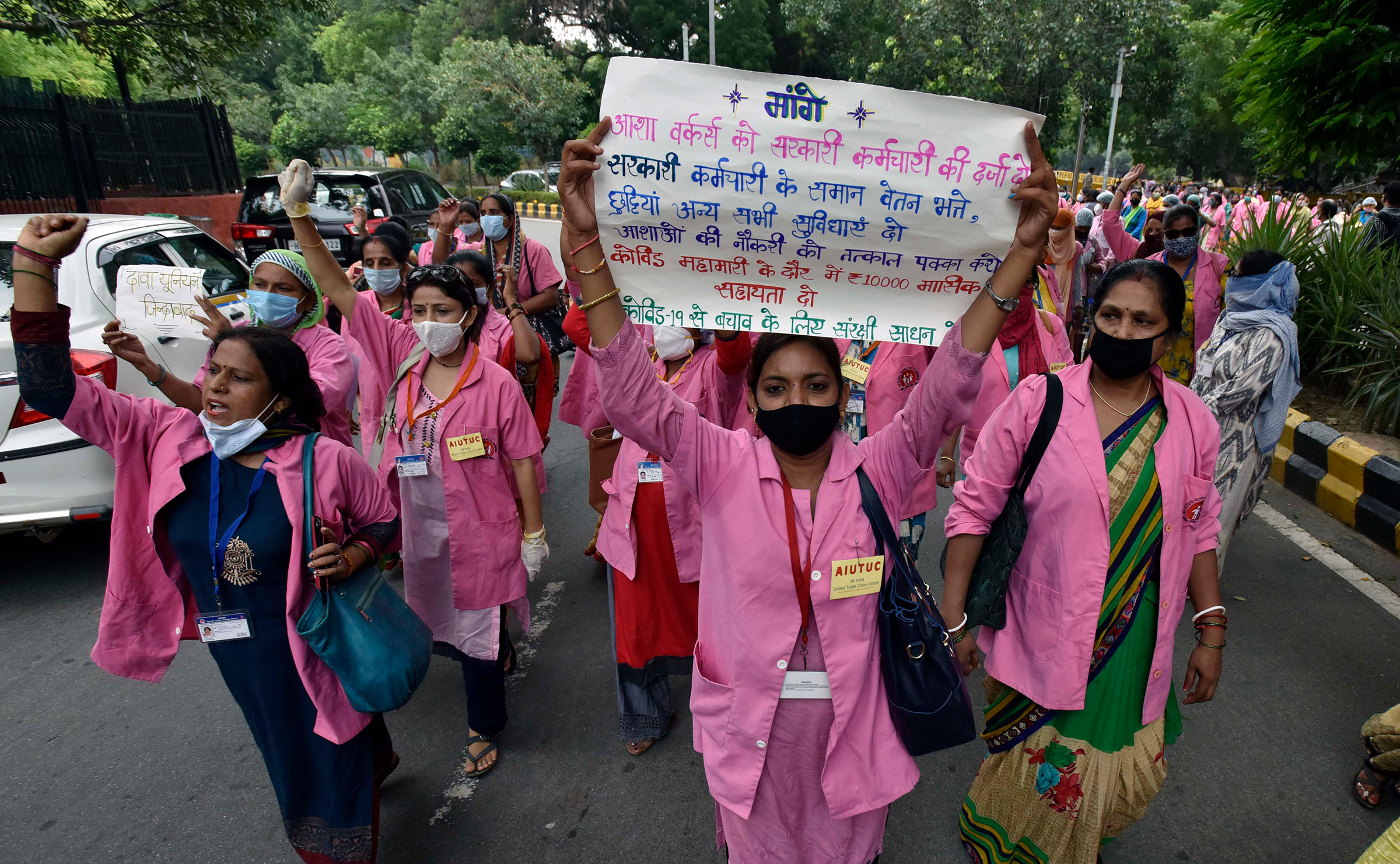 ASHA workers protest against alleged negligence of their workforce by the government on August 9, 2020 in New Delhi. During the protest, ASHA workers demanded payment for their work during the COVID-19 pandemic, saying they have not been paid for the pas