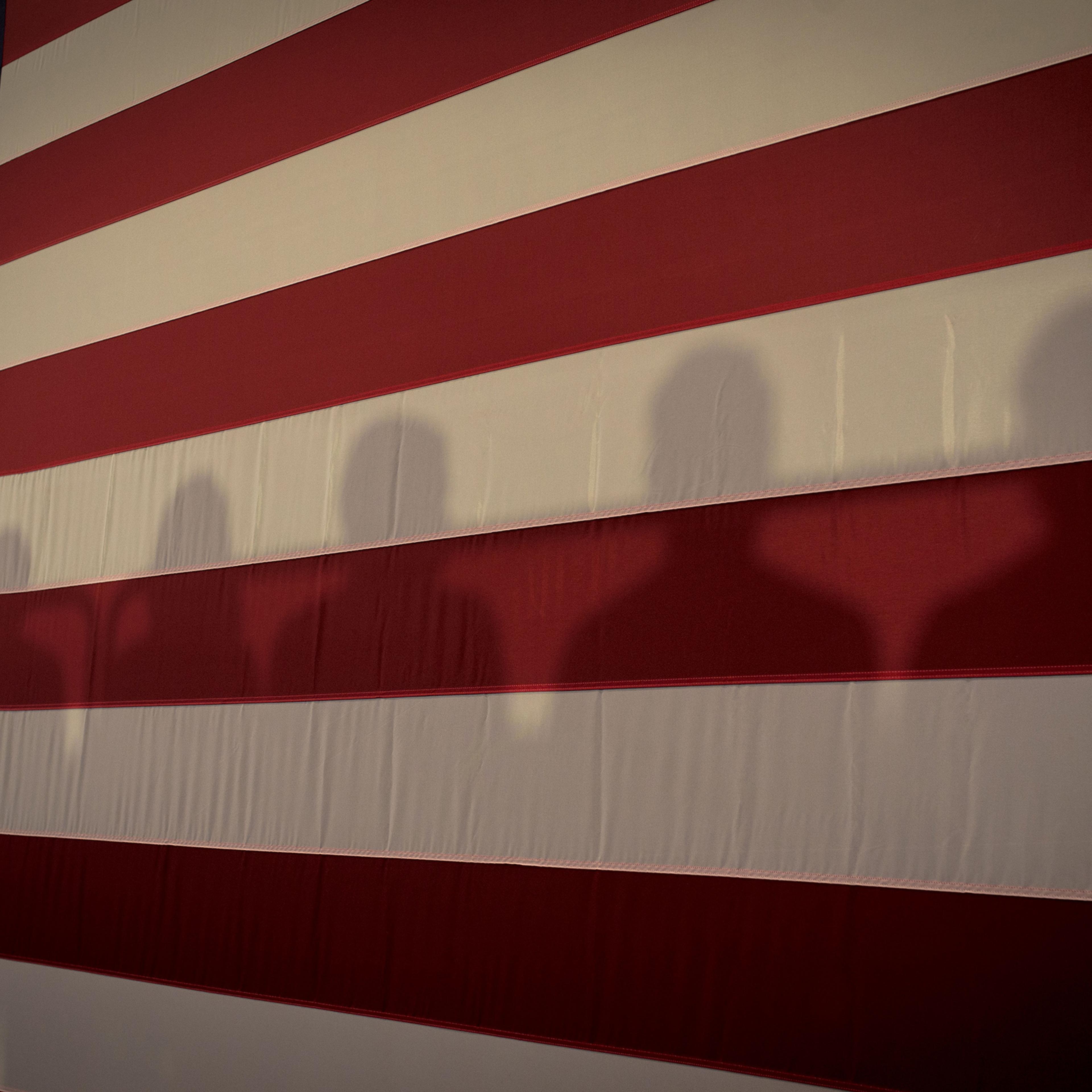 Shadows on an American Flag at Cedar Rapids Town Hall with Kamala Harris in Cedar Rapids, Iowa, Sept. 19, 2019