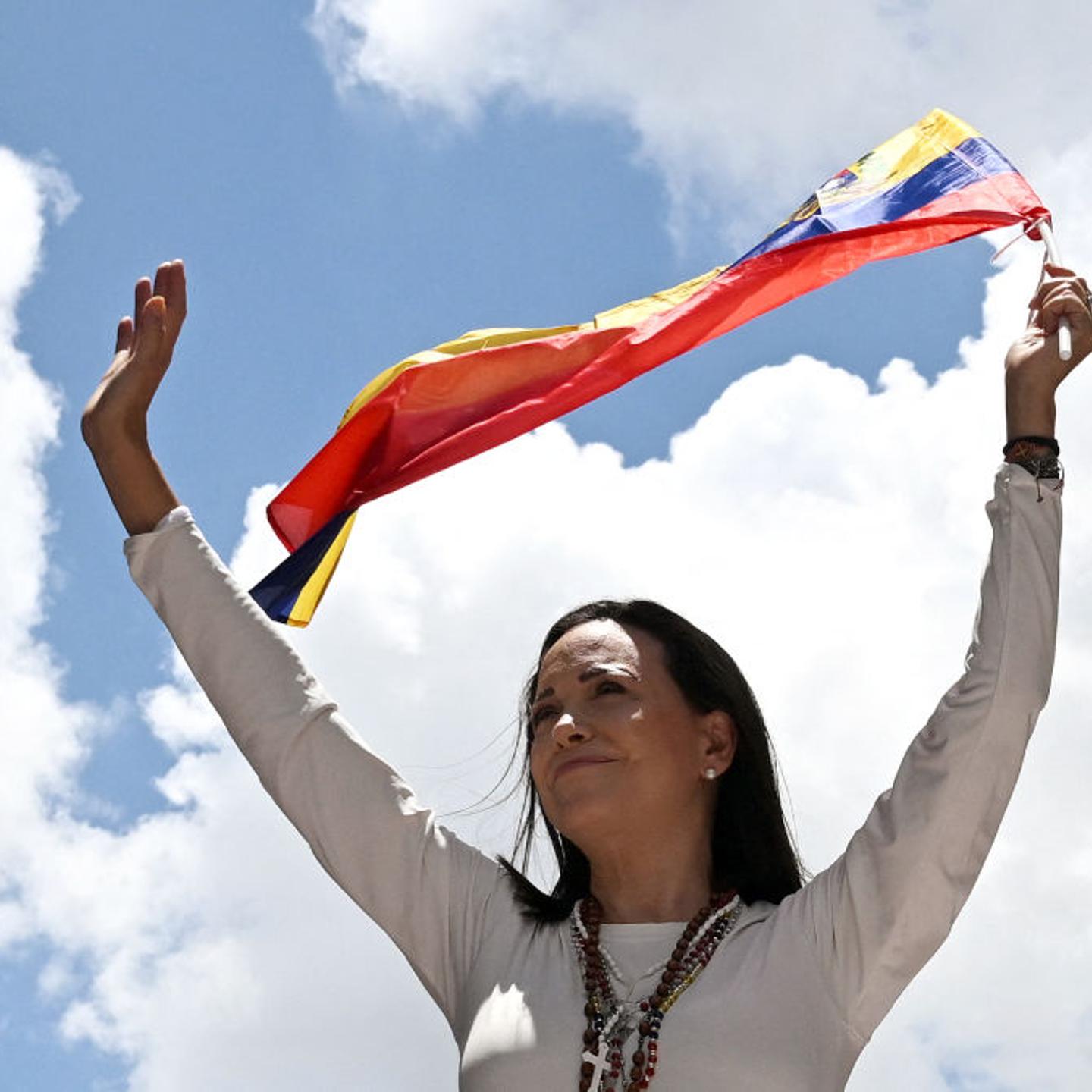 Venezuelan opposition leader Maria Corina Machado waves a Venezuelan flag during a rally in Caracas on August 28, 2024.