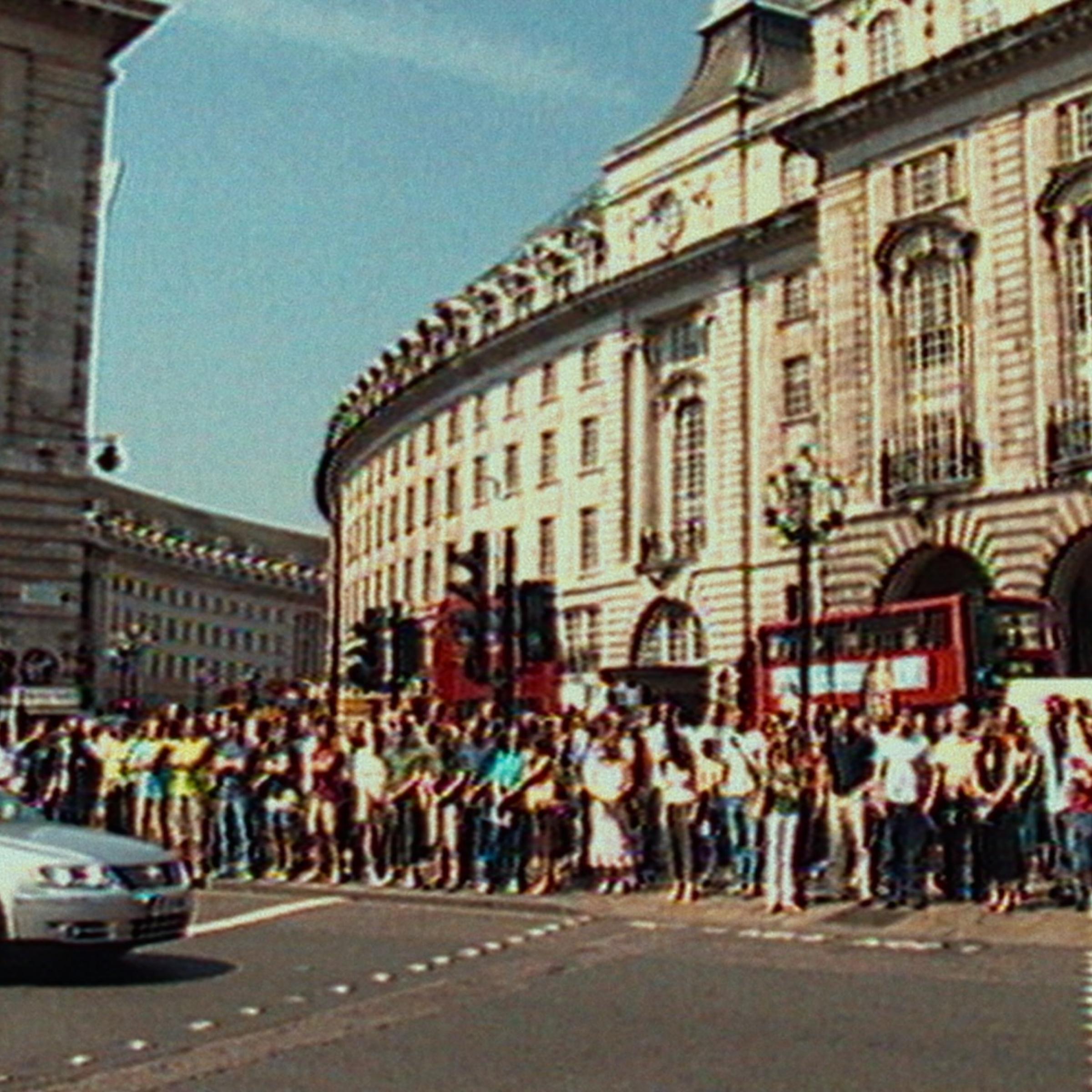 Attack on London: Hunting The 7/7 Bombers. Crowd stands in Picadilly for 2 minute silence in Attack on London: Hunting The 7/7 Bombers. Cr. Courtesy of Netflix © 2025