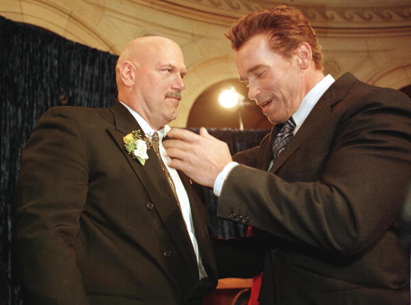 Former pro wrestling bad guy Jesse Ventura (L) is congratulated by US actor Arnold Schwarzenegger (R) moments after Ventura was sworn in as Minnesota state's 38th governor 04 January in St. Paul, Minnesota.