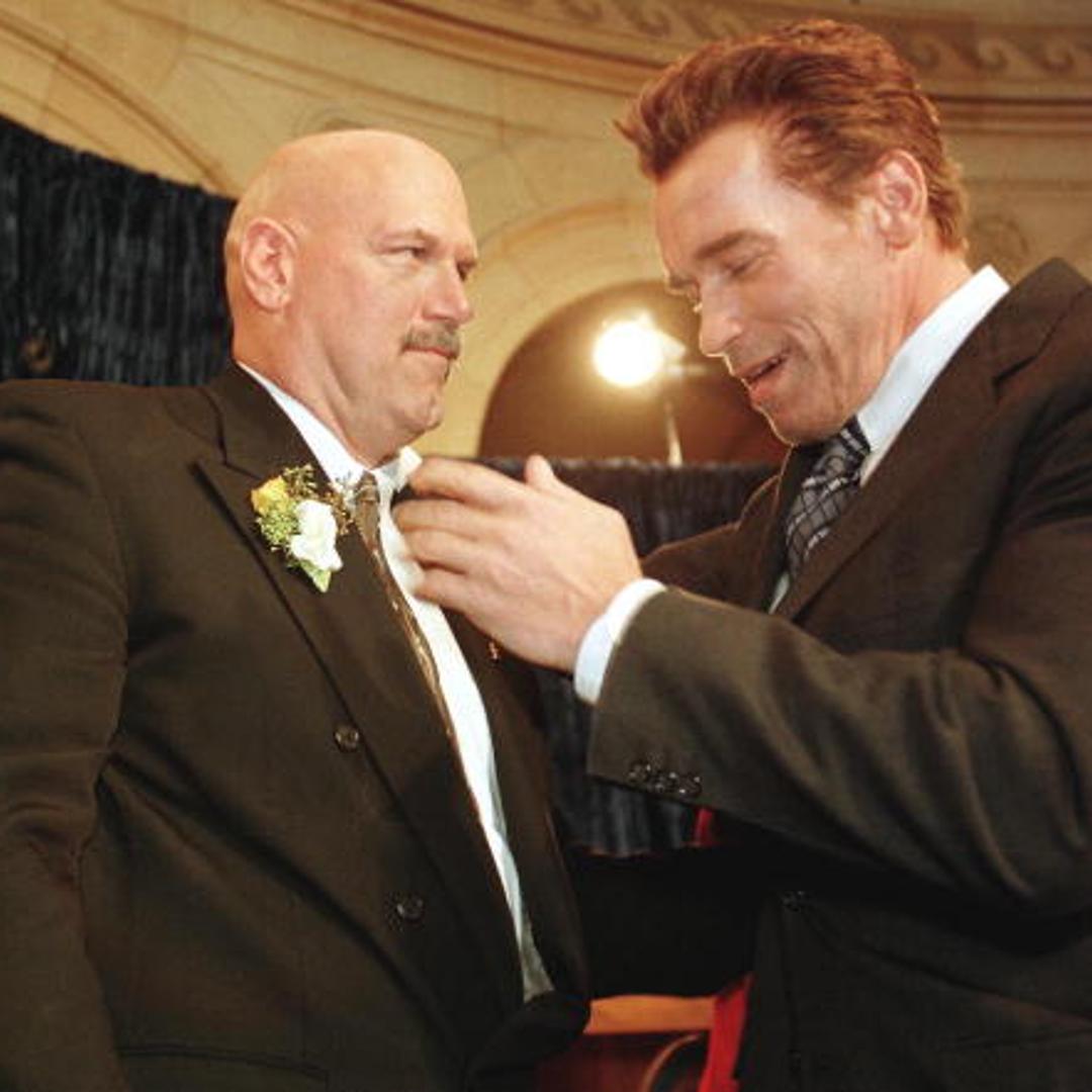 Former pro wrestling bad guy Jesse Ventura (L) is congratulated by US actor Arnold Schwarzenegger (R) moments after Ventura was sworn in as Minnesota state's 38th governor 04 January in St. Paul, Minnesota.