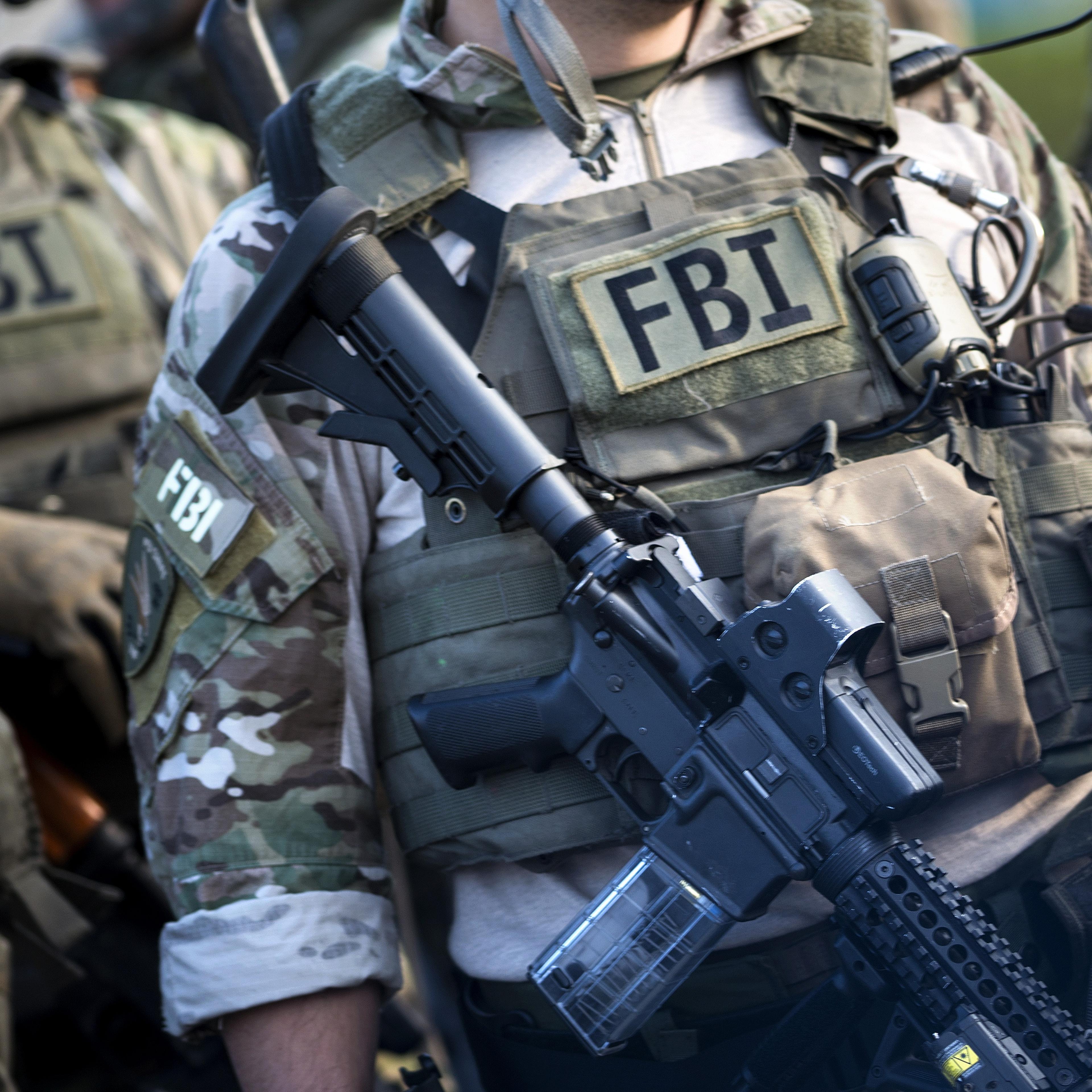 Members of a Federal Bureau of Investigation SWAT team are seen during an FBI field training exercise at the Landmark Mall on May 2, 2014 in Alexandria, Virginia.