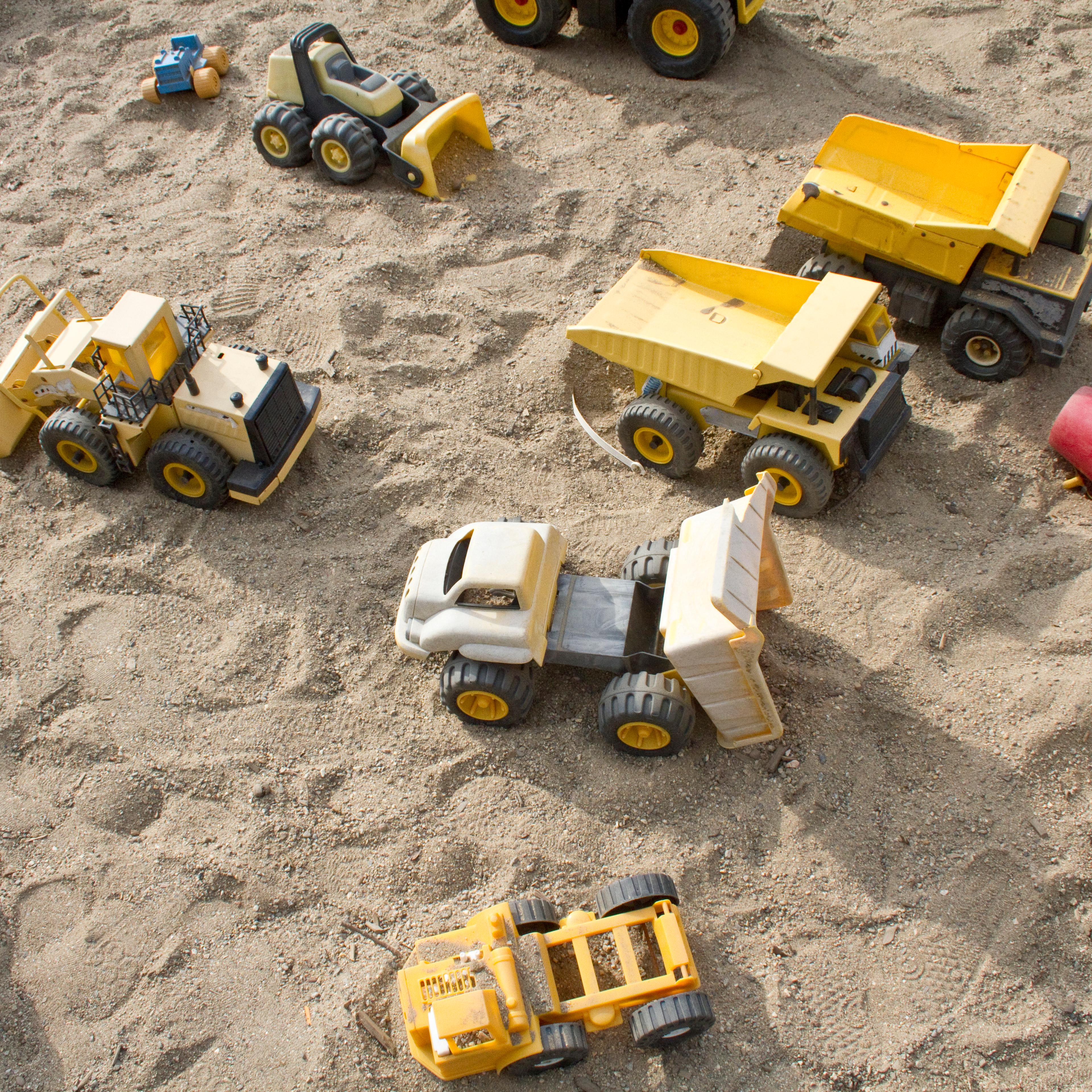 Toy trucks in a sandbox